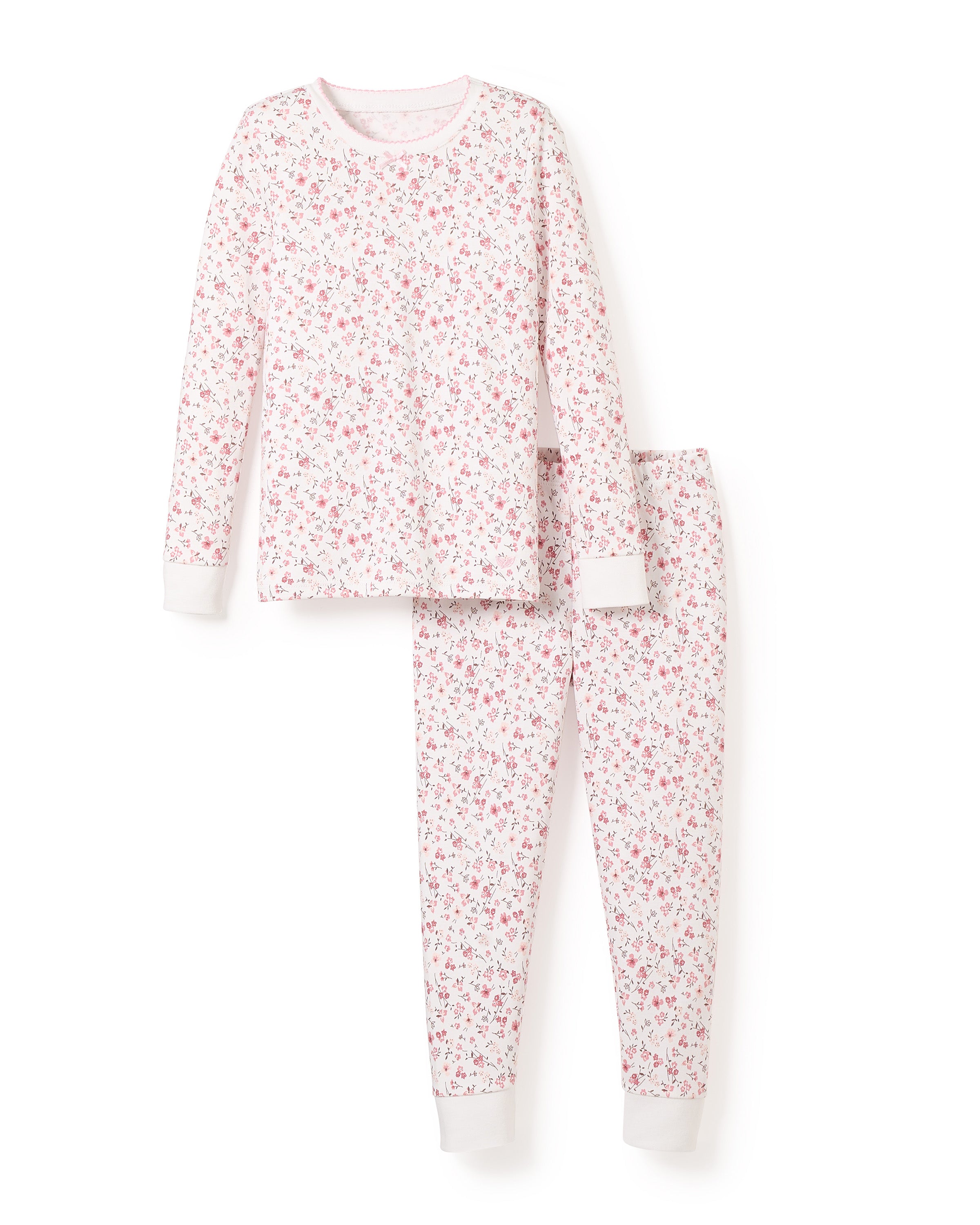 The Kids Pima Snug Fit Pajama Set in Dorset Floral by Petite Plume showcases a floral long-sleeve top and matching pants with small pink flowers on a white background, accented by light pink cuffs and neckline. Its elegantly displayed on a plain white backdrop.