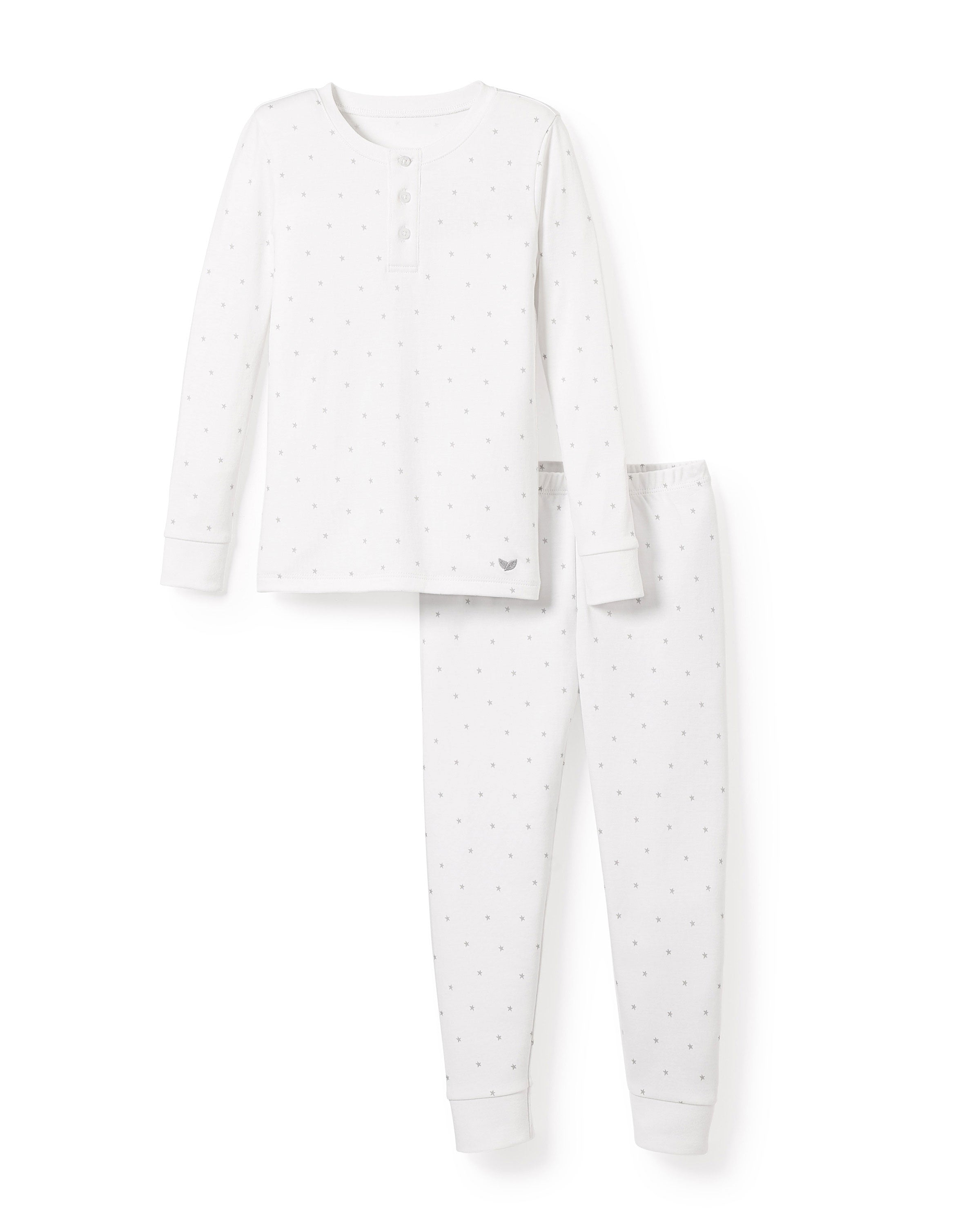 The Kids Pima Snug Fit Pajama Set by Petite Plume features a white long-sleeved buttoned henley top and matching pants, both crafted from soft Pima cotton with subtle gray star patterns, elegantly displayed against a plain white background.