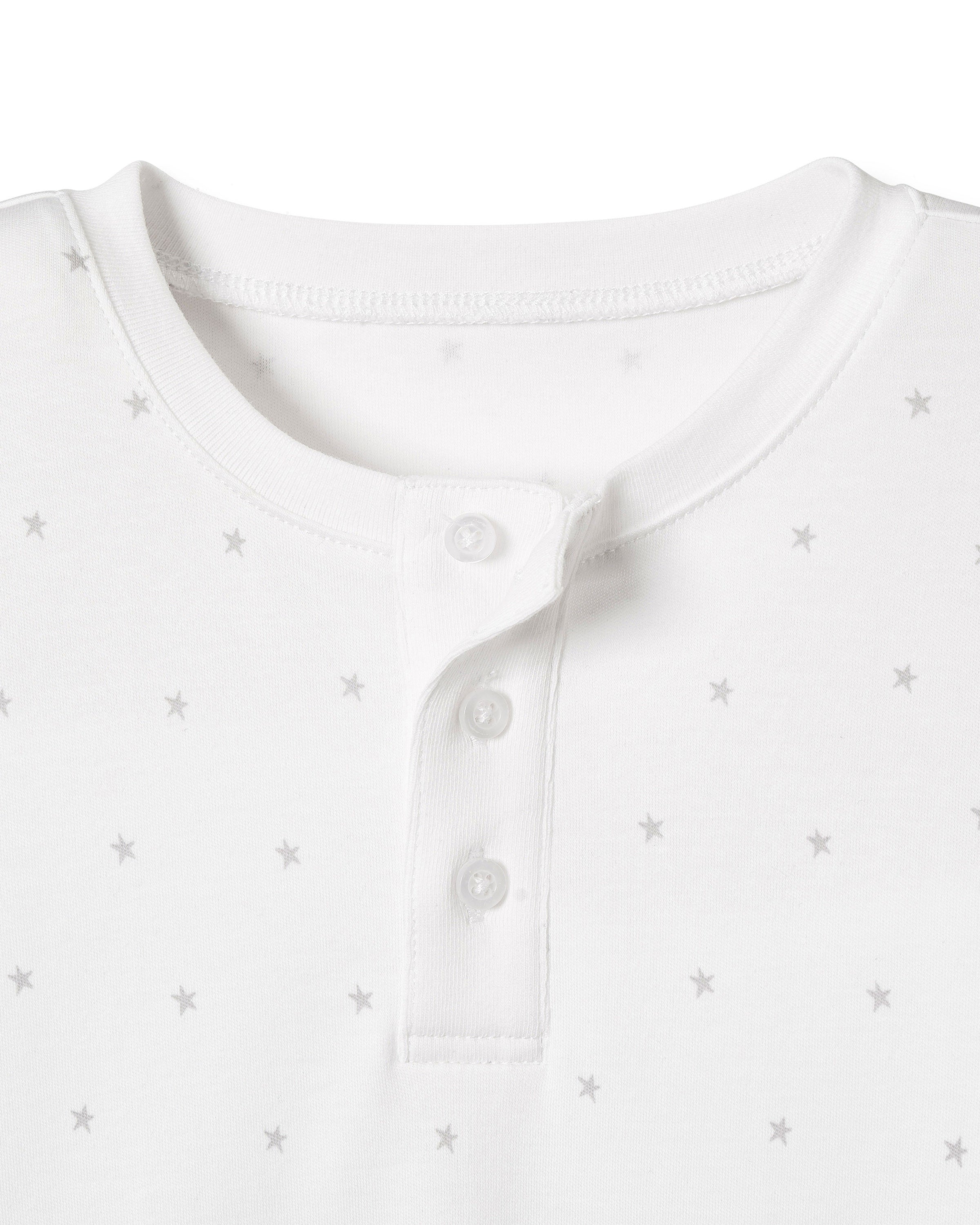 Close-up of the Kids Pima Snug Fit Pajama Set in Grey Stars by Petite Plume. This long sleeve top features a round neckline, subtle light gray star pattern, and a partial button-up placket with two fastened buttons.
