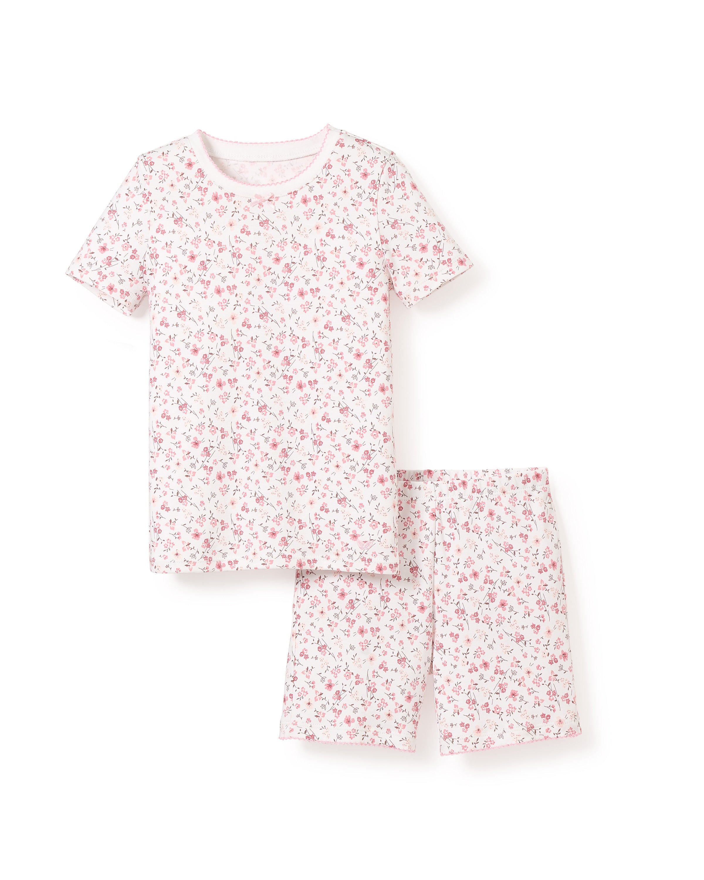 The Kids Pima Snug Fit Pajama Short Set in Dorset Floral by Petite Plume is made from soft Pima cotton, featuring a short-sleeved top and shorts with a pink and red floral design on white.