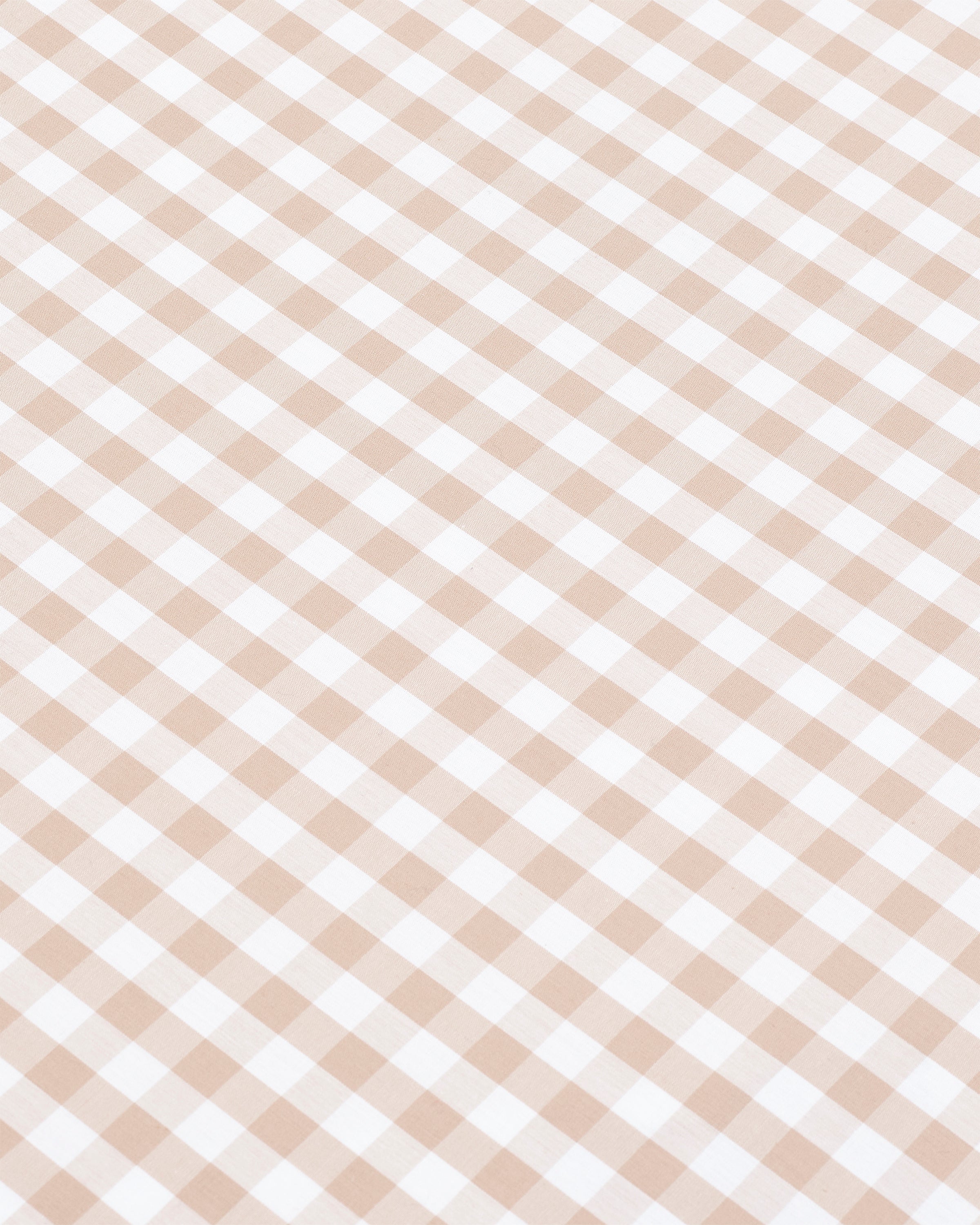 Two Luxe Premium Percale Pillow Cases in Camel Gingham, featuring a beige and white checkered design, are stacked on top of each other against a plain white background.