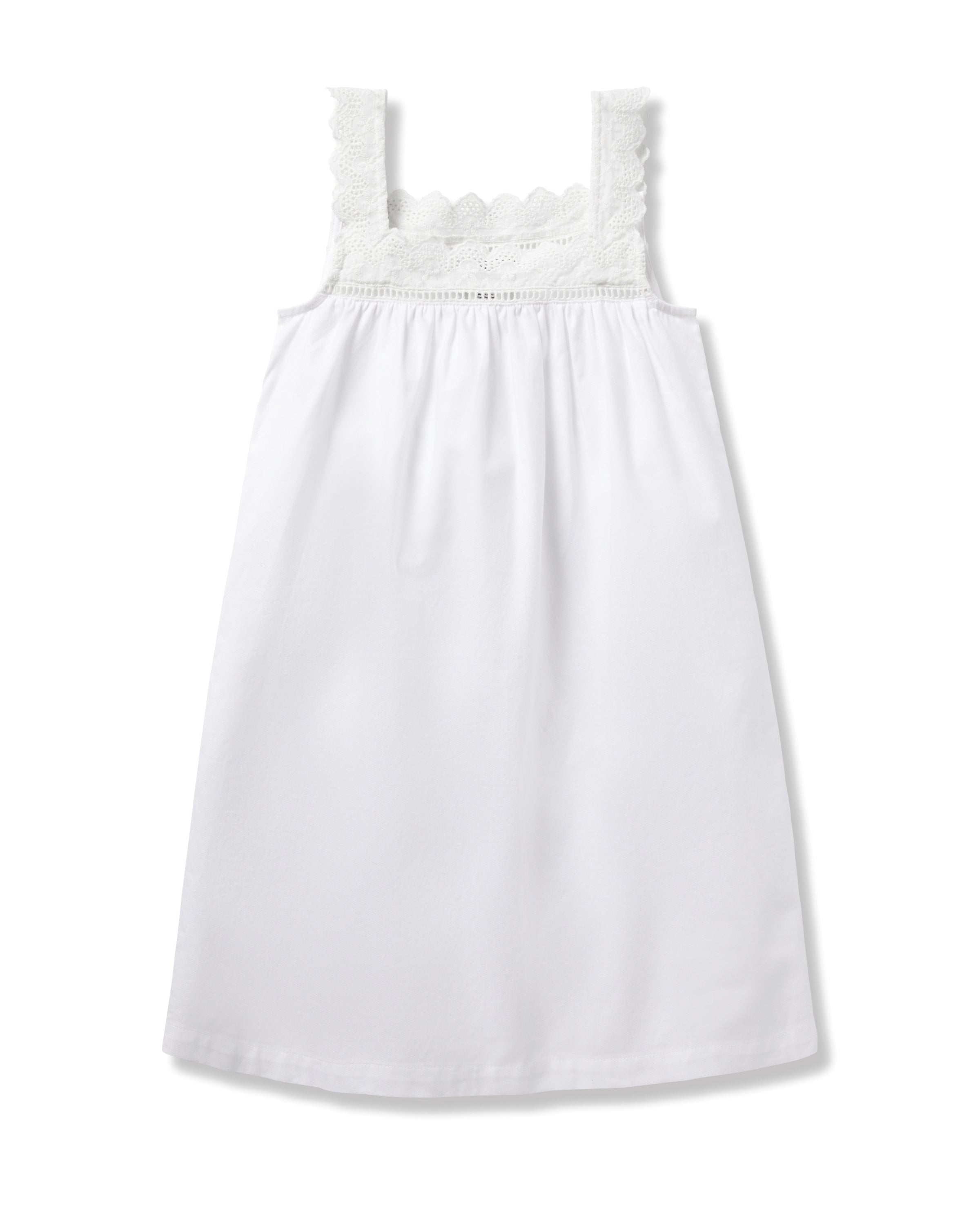 The Girls Twill Esme Nightgown in White by Petite Plume, made from yarn-dyed cotton, boasts a scalloped lace trim on the neckline and straps. Its sleeveless design and lightweight fabric offer a simple yet elegant look with a relaxed fit.