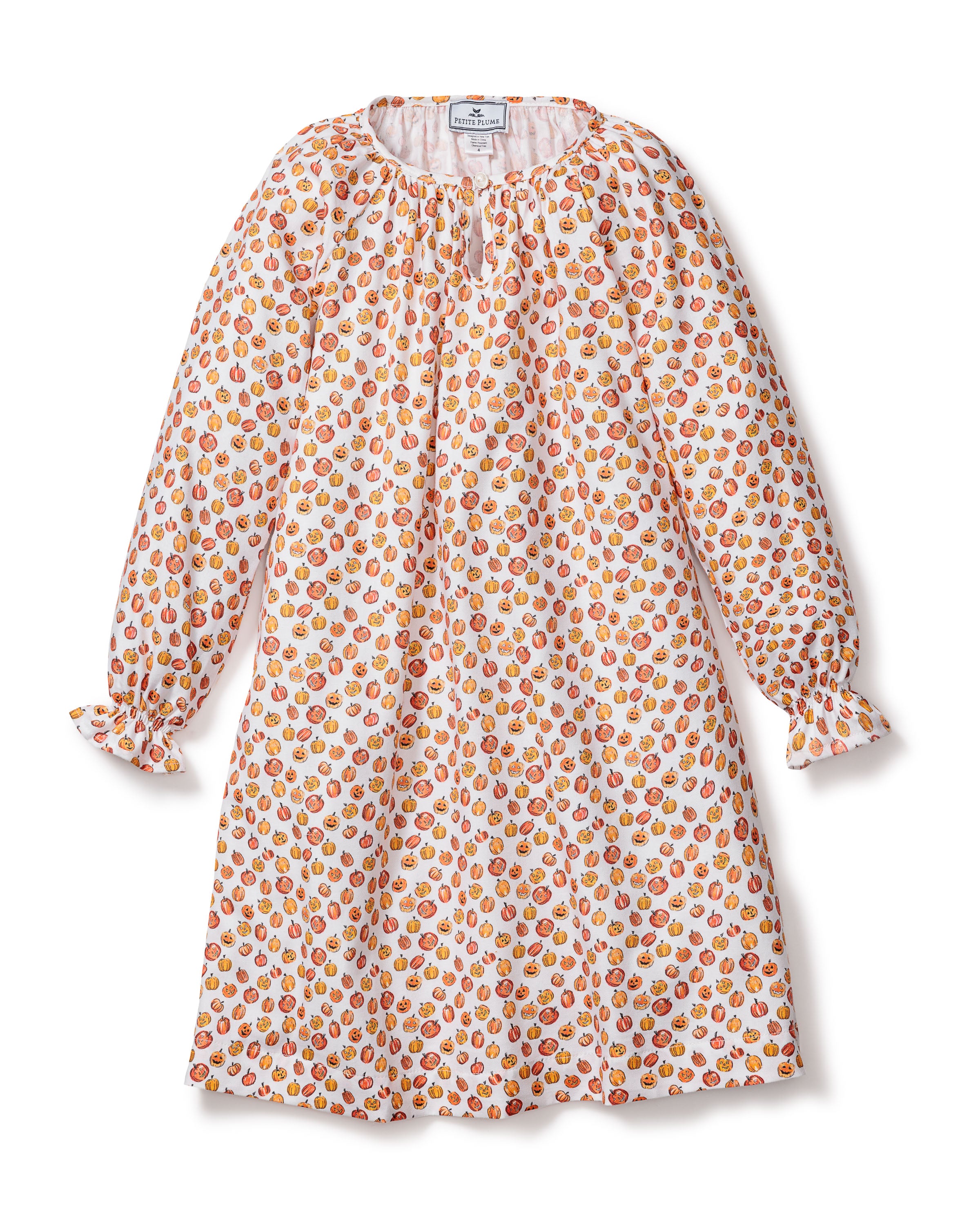 The Petite Plume Girls Delphine Nightgown in Pumpkin Patch features a playful, colorful pattern of cartoon pumpkins on white. This chemical-free, cozy nightgown adds charm with its gathered neckline and subtly ruffled cuffs, perfect for Halloween sleepwear.