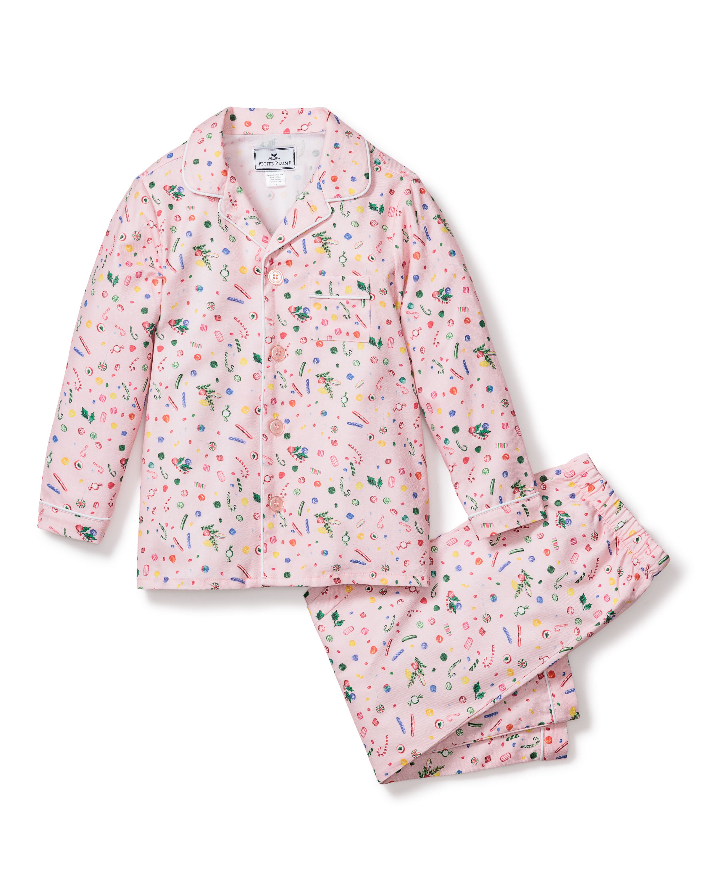 Petite Plumes Kids Twill Pajama Set in Vintage Sweets features a playful multicolored confetti pattern. Crafted from chemical-free fabric, it includes a pink long-sleeve button-up top with chest pocket and matching pants.