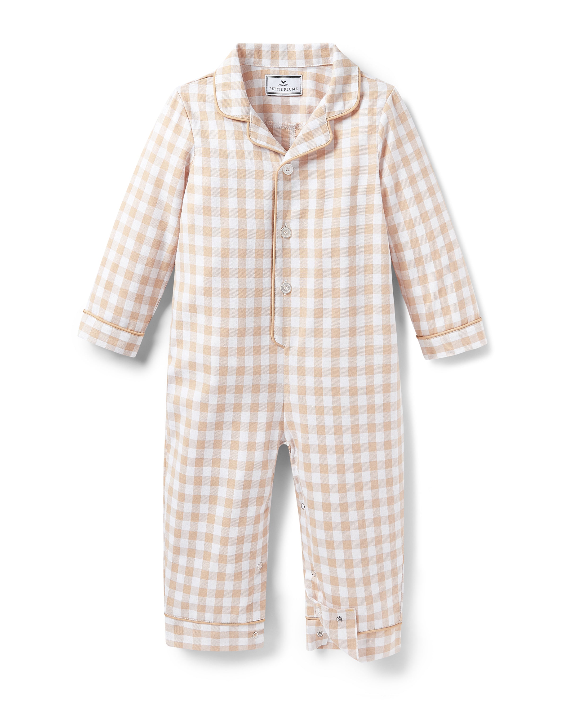 The Baby's Twill Classic Romper in Camel Gingham features long sleeves, a beige and white gingham check pattern, front buttons, snap closures at the legs, a collar, and cuffed sleeves and legs.
