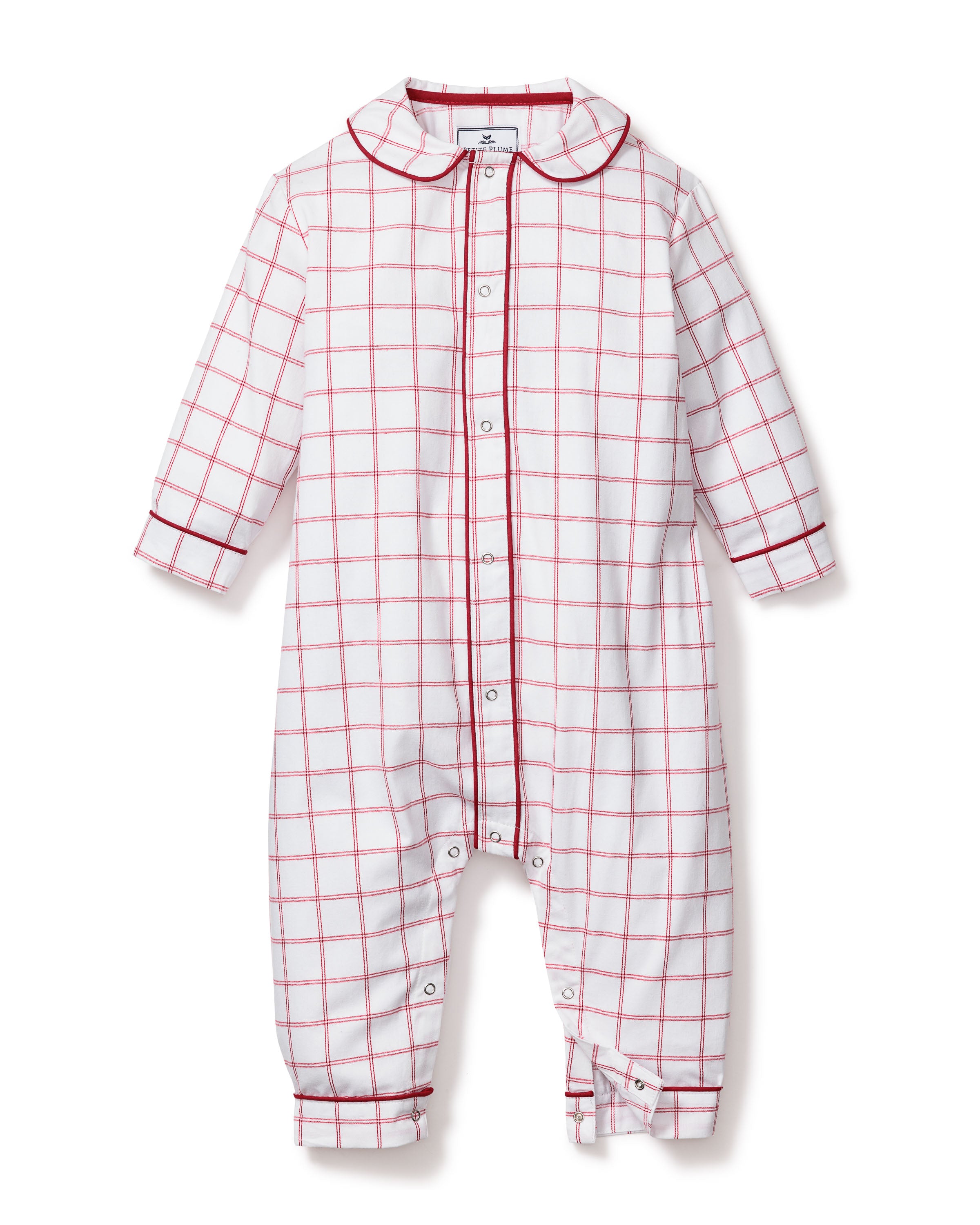 The Babys Twill Cambridge Romper by Petite Plume is a flame-retardant onesie in garnet tattersall with a red and white checkered pattern, featuring long sleeves, a collar, button-up front, and ankle cuffs against a plain white background.