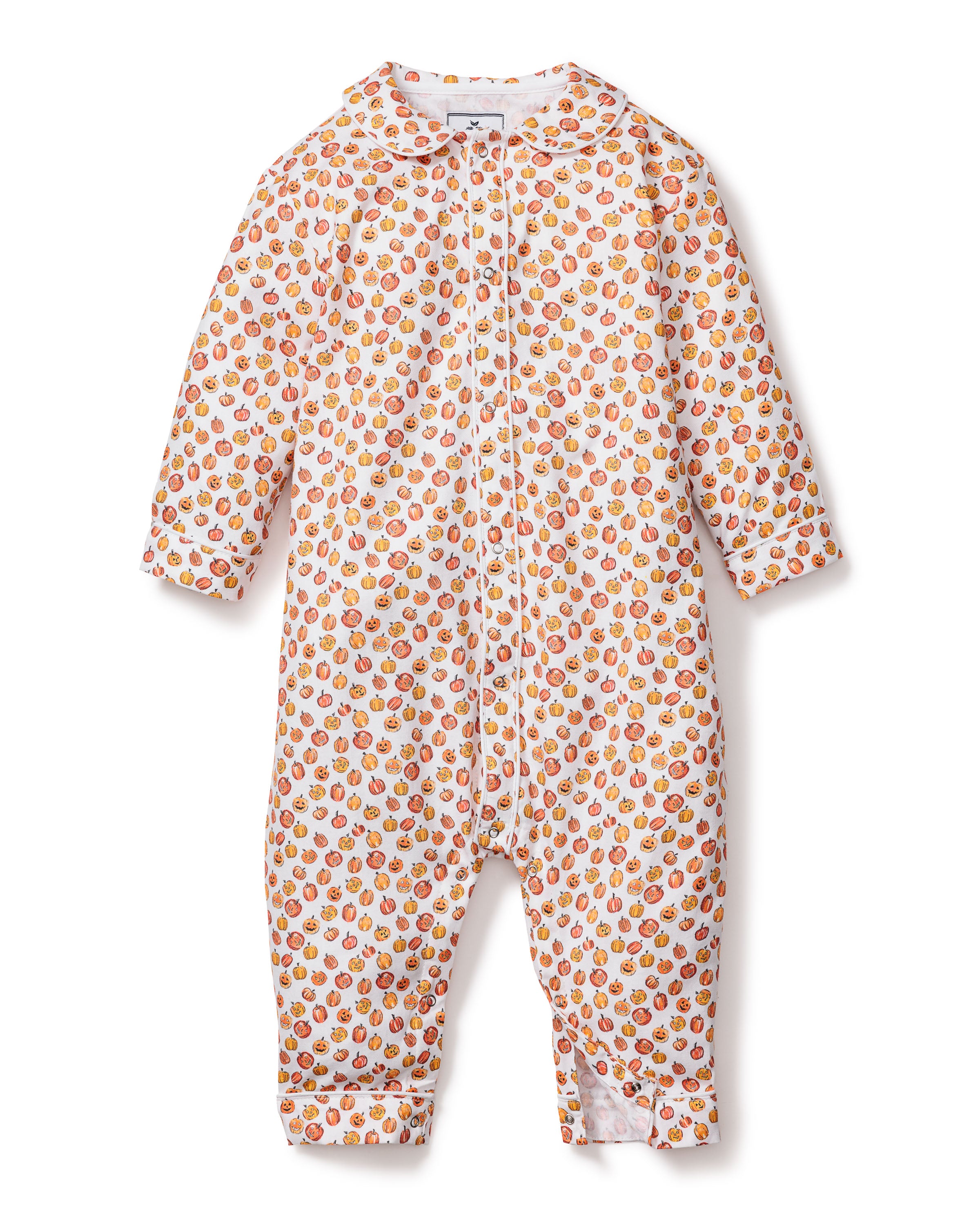 Petite Plumes Babys Twill Cambridge Romper in Pumpkin Patch features a playful kids print, with colorful strawberries and oranges on a white background. It has long sleeves, a front zipper, and covered feet for cozy comfort.