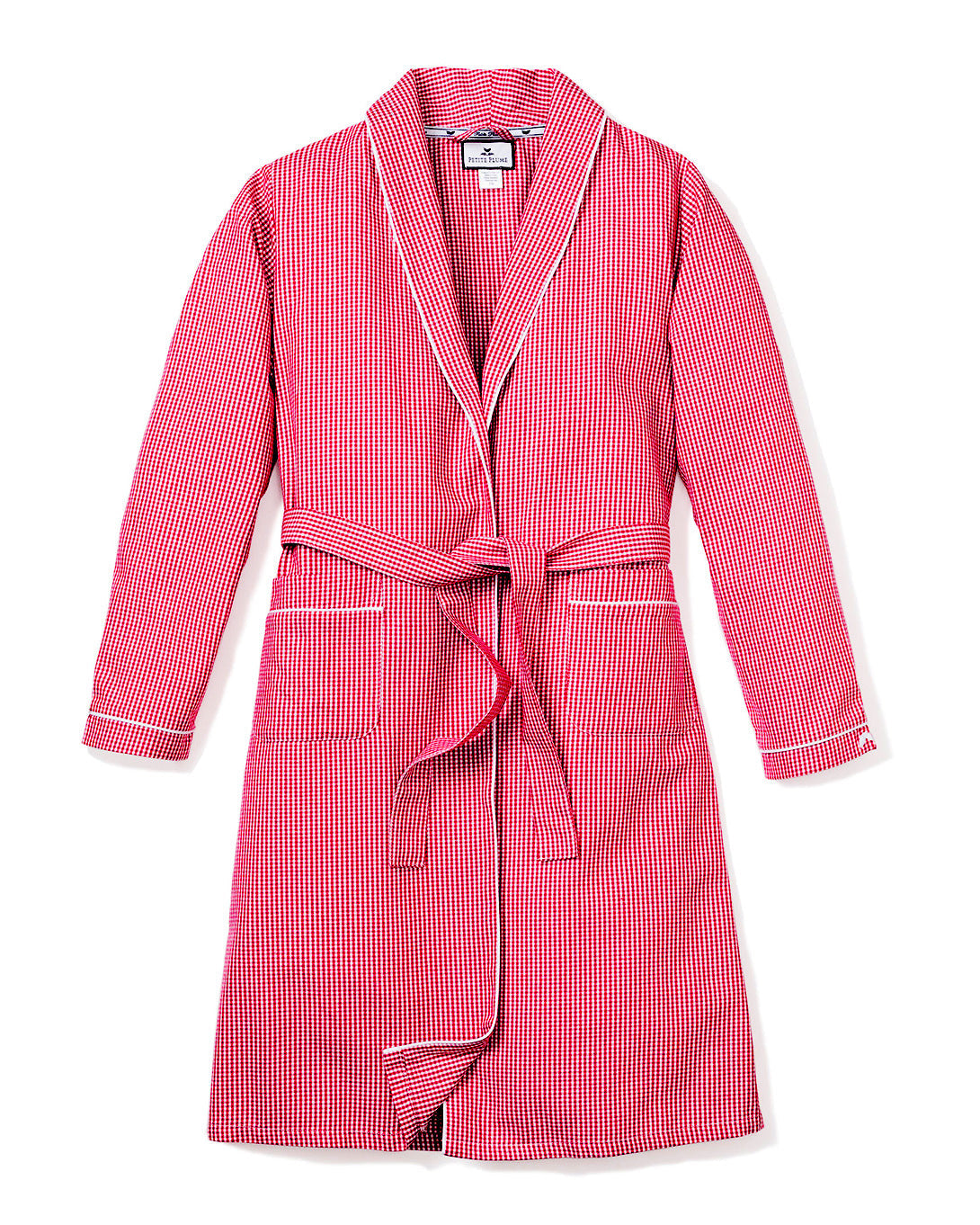 The Kids Flannel Robe by Petite Plume features a red mini gingham print, long sleeves, lapels, white piping, a matching belt for closure, two front pockets, and is displayed against a plain white background.
