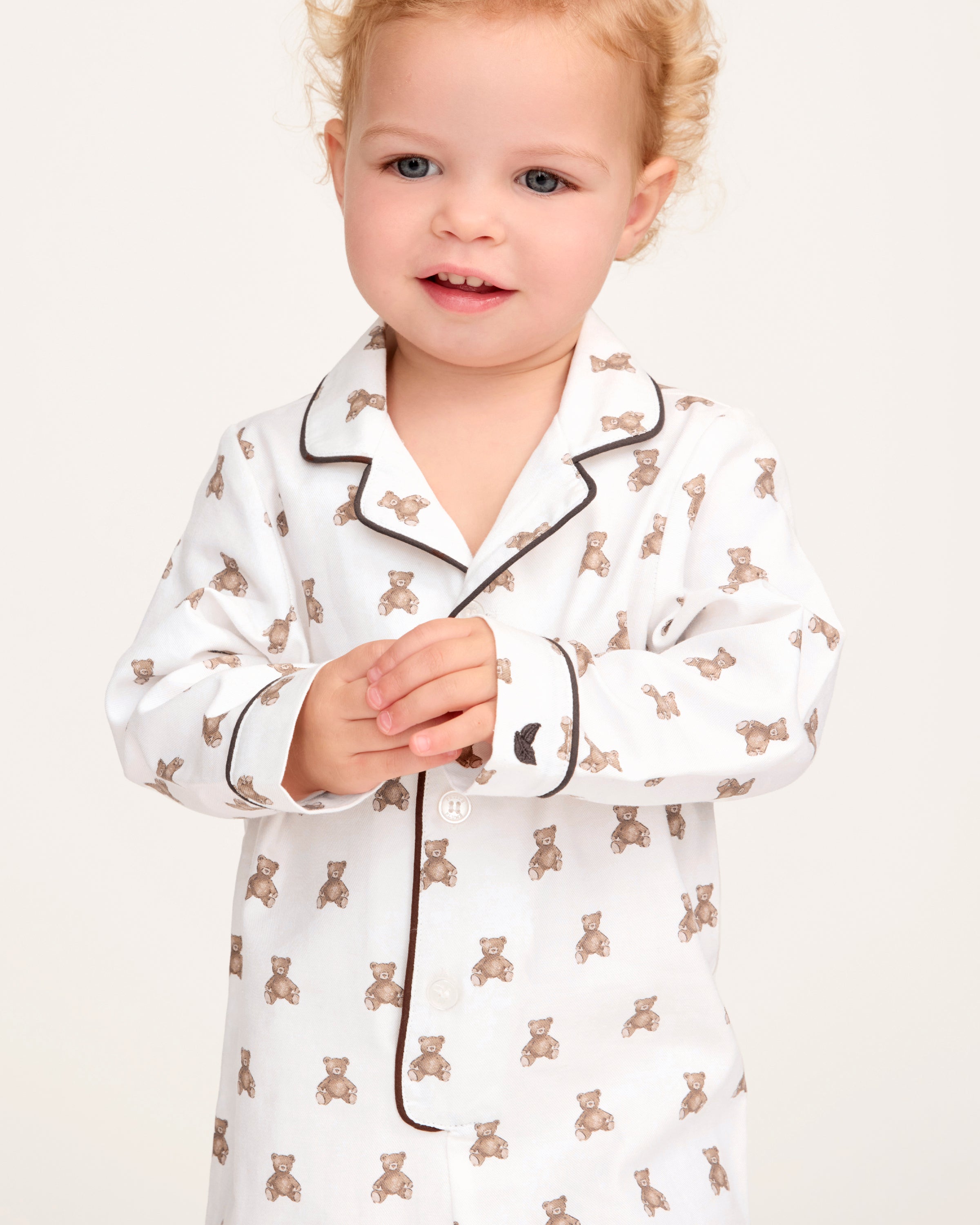 A white and brown Baby's Twill Classic Romper in Teddy Tales.