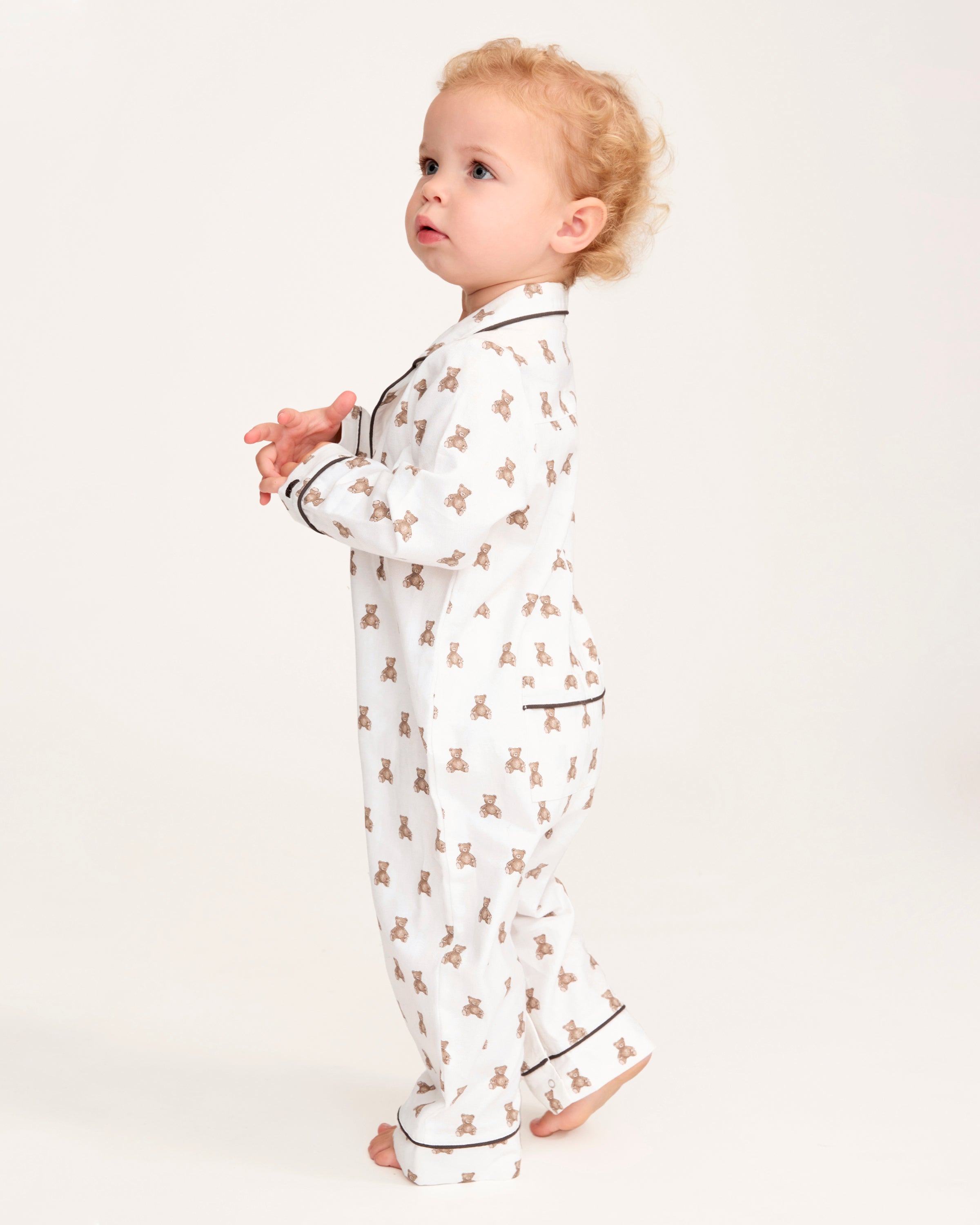A white and brown Baby's Twill Classic Romper in Teddy Tales.