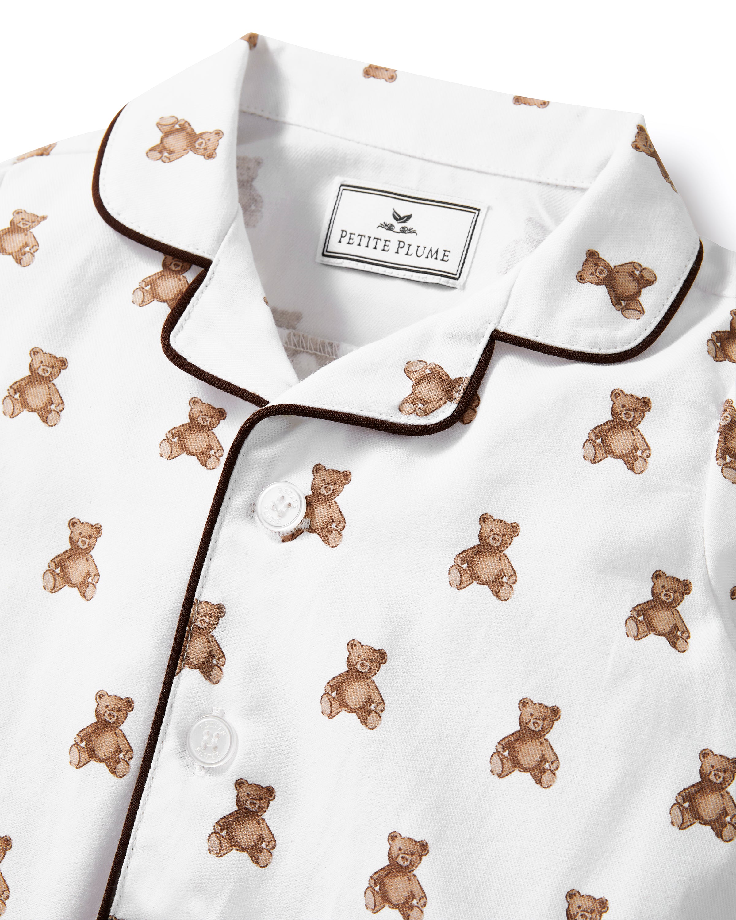 A white and brown Baby's Twill Classic Romper in Teddy Tales.