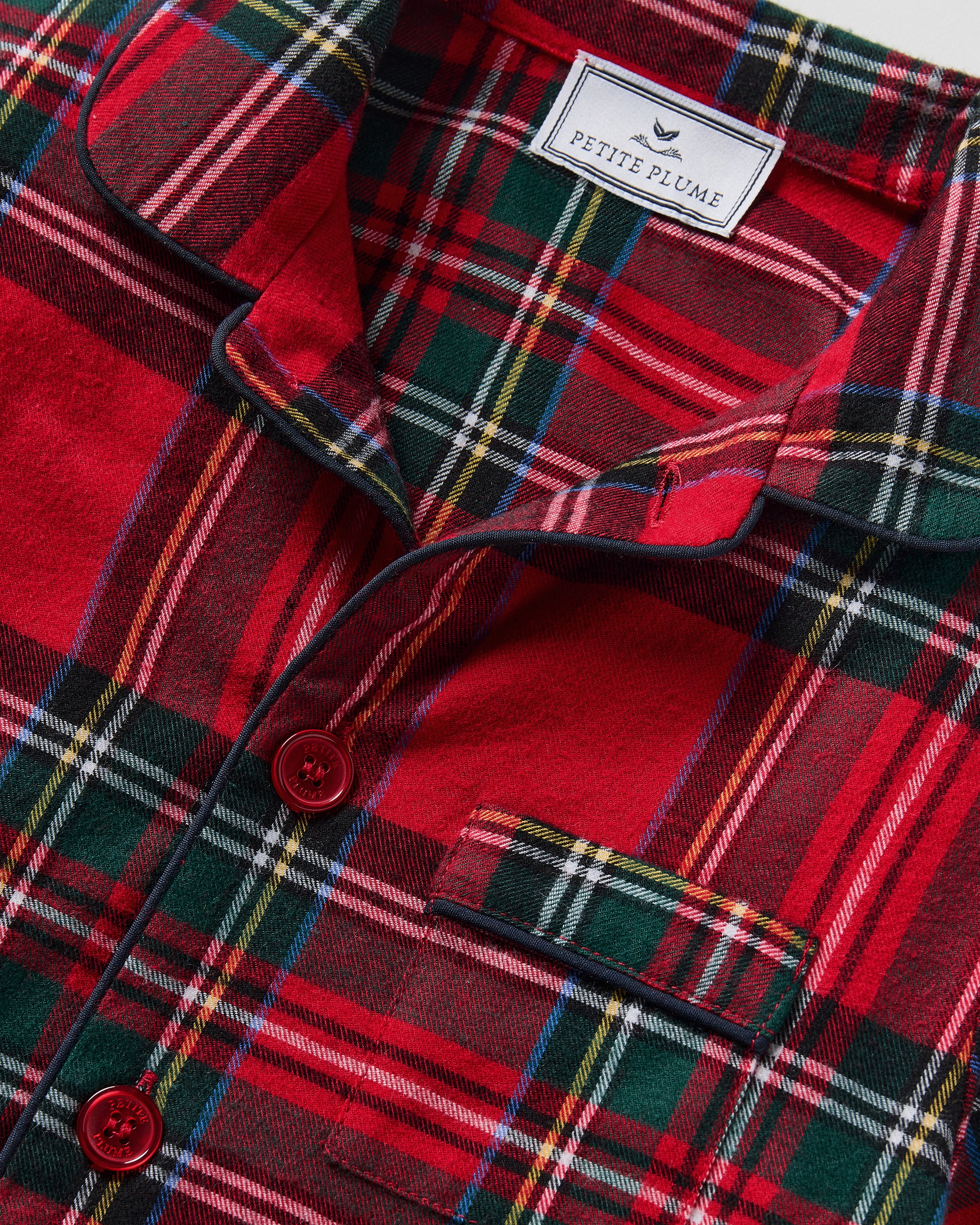 The Kid's Brushed Twill Short Set in Imperial Tartan features red plaid with green, black, and white stripes, including a short-sleeve button-up shirt with a chest pocket and matching elastic waistband shorts.