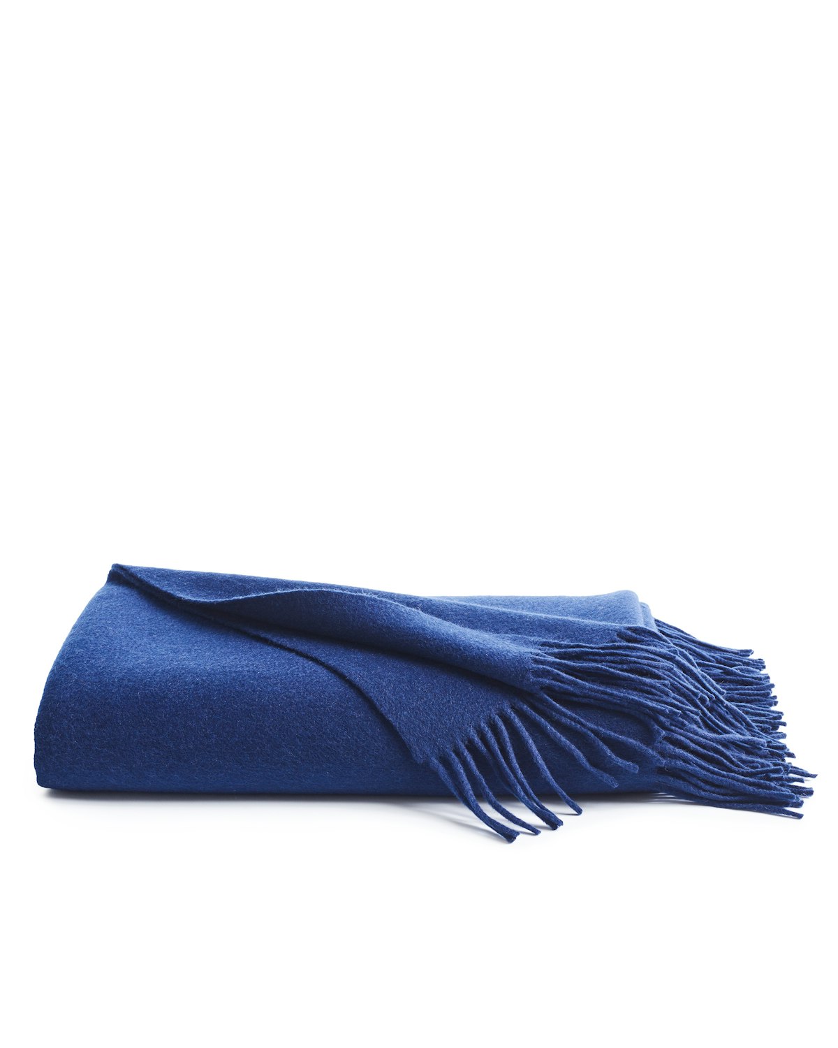 A neatly folded Petite Plume Cashmere Fringe Throw in Navy, displayed against a white background. This elegant piece enhances home decor and is exceptionally giftable for any occasion.