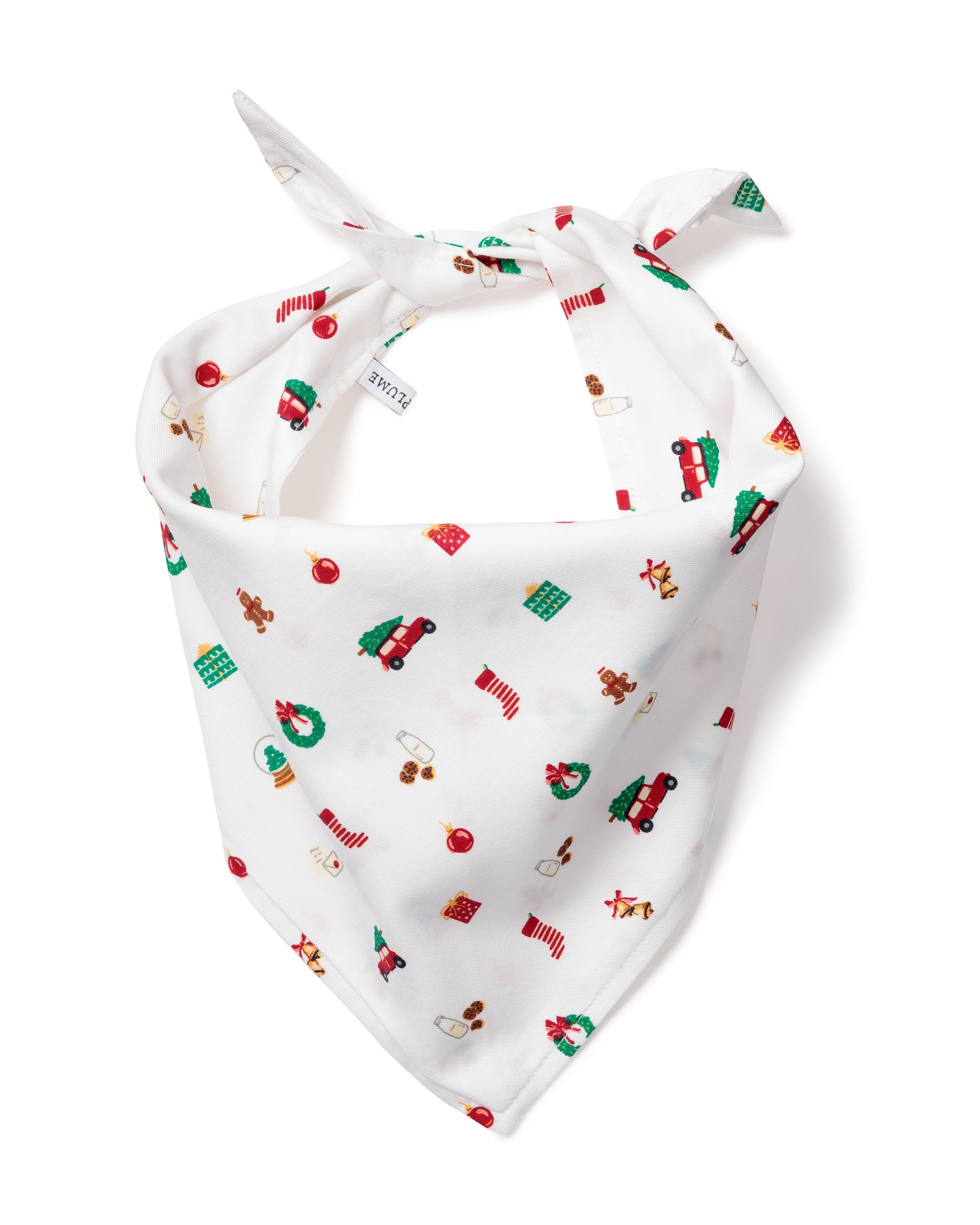 The Petite Plume Dog Twil Bandana in Winter Nostalgia features colorful holiday-themed prints like wreaths, candy canes, gingerbread men, and wrapped gifts. Folded and tied at the top, its perfect for adding festive cheer to your furry friends attire.