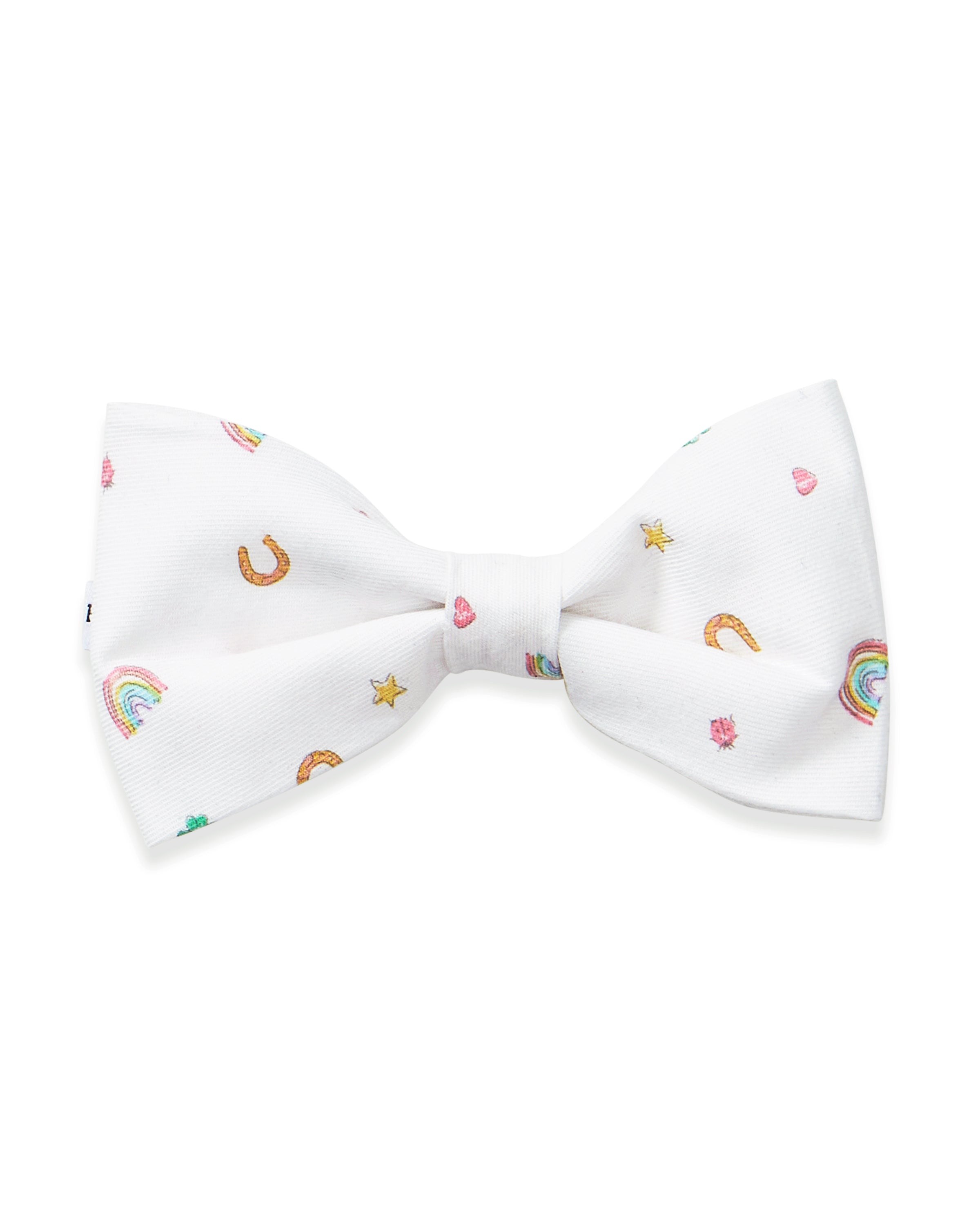 The Twill Dog Bow Tie in Good Luck Charms is a white bow tie adorned with small, colorful rainbows, horseshoes, hearts, and stars scattered across the fabric.