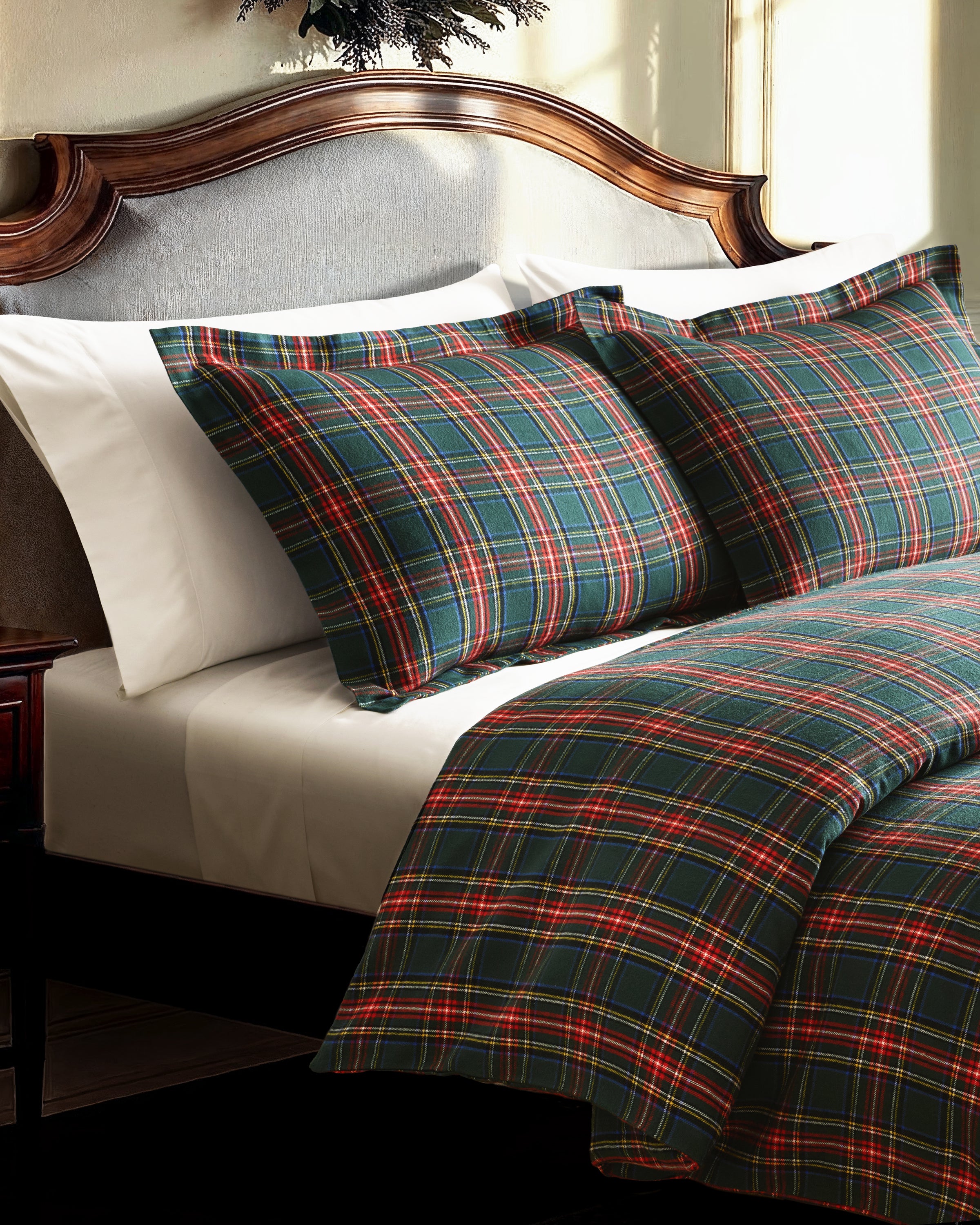 The Flannel Duvet Set in Kensington Tartan features a green, red, and white plaid pattern and includes a comforter and two pillows, all neatly folded against a white background.