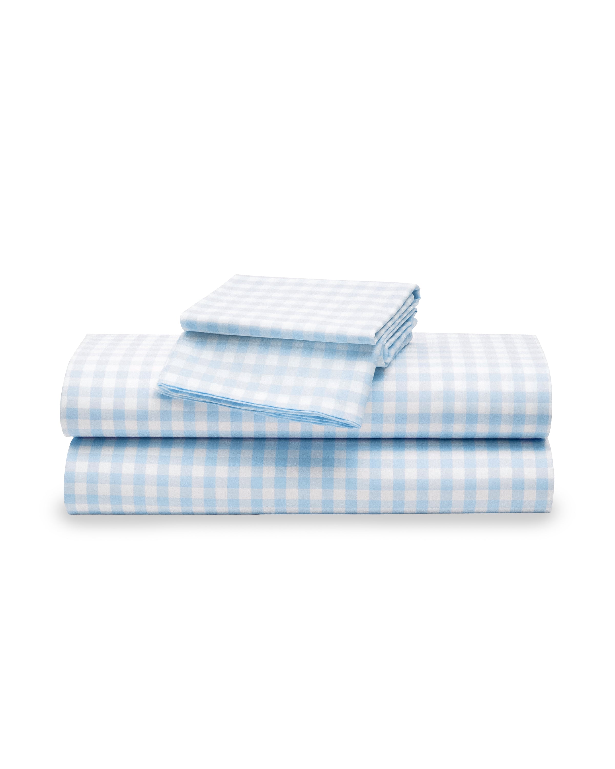 A neatly folded stack of Luxe Premium Cotton Light Blue Gingham Bed Sheets by Petite Plume, featuring a fitted sheet, flat sheet, and pillowcases made from 100% cotton, is placed against a white background.