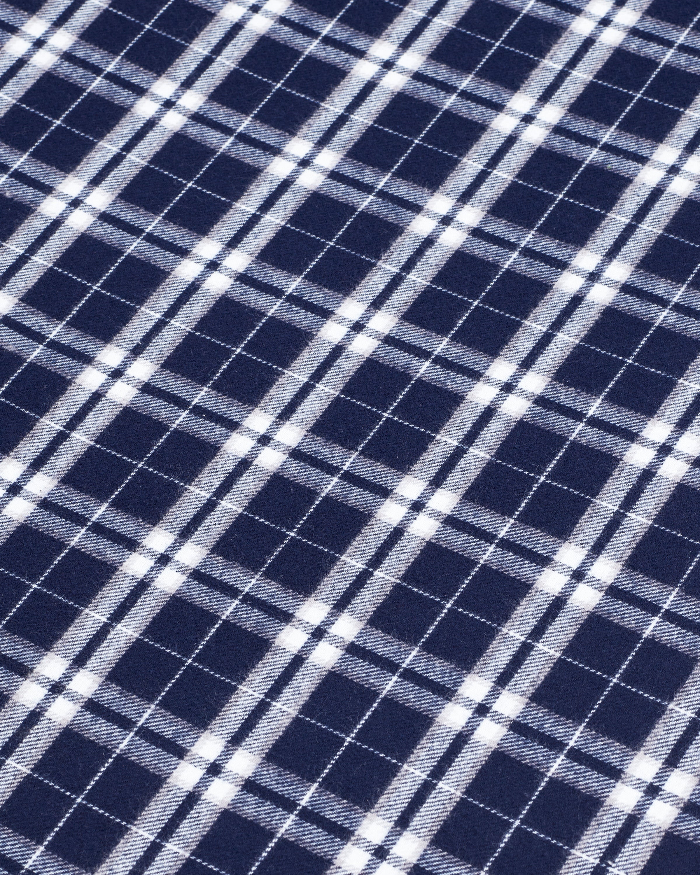 The Flannel Duvet Set in Oxford Tartan features a neatly folded blue and white plaid comforter with two matching pillowcases stacked on top, displayed against a plain white background.