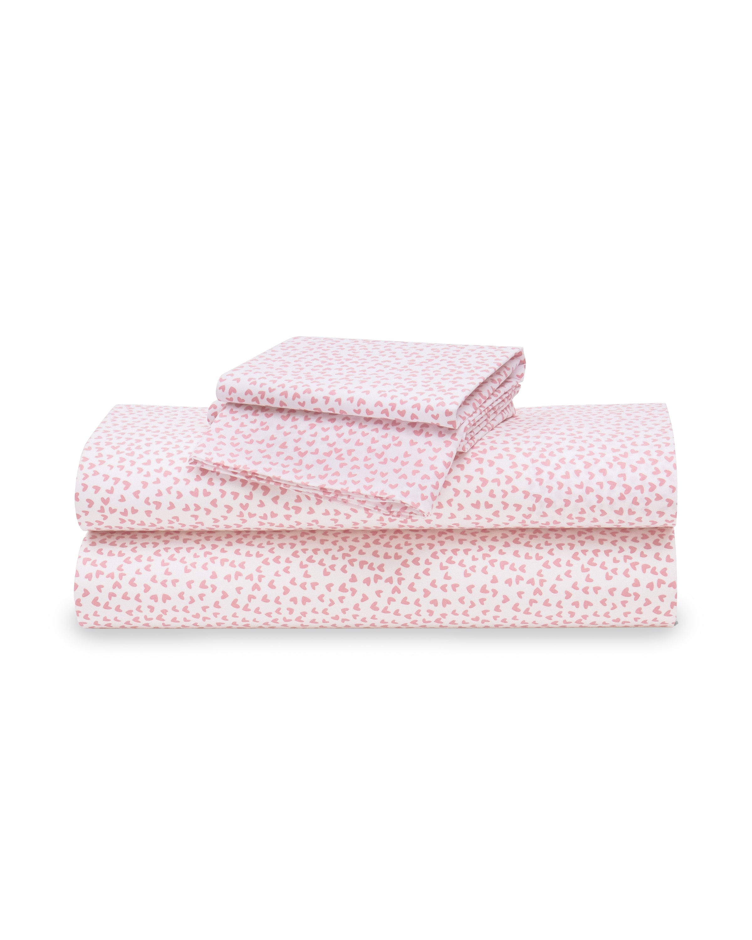 Petite Plumes Luxe Premium Cotton Sweethearts Bed Sheets, featuring a pink heart pattern on white, include a fitted sheet, flat sheet, and two pillowcases, all neatly arranged for a touch of luxury.