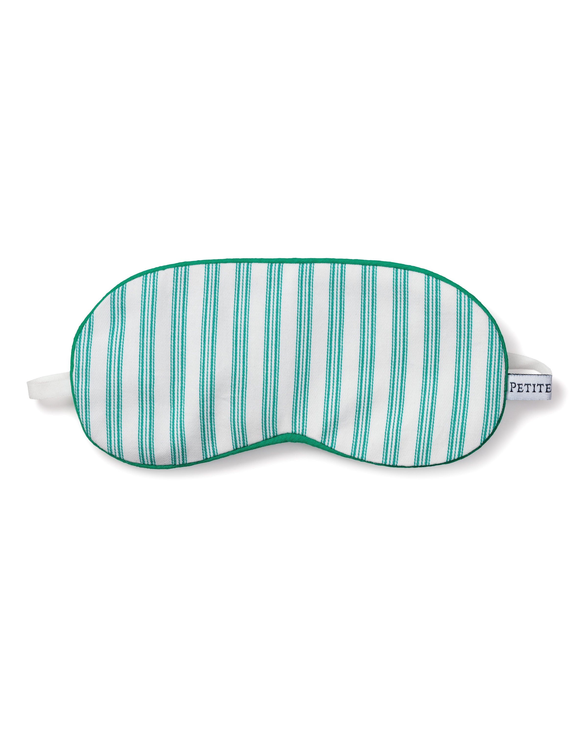 The Kids Twill Sleep Mask in Emerald Ticking by Petite Plume is perfect for luxurious sleepwear. It has green and white stripes, a green trim, and white elastic straps. The tag reads PETITE, making it ideal for a monogrammed gift offering personalized comfort.