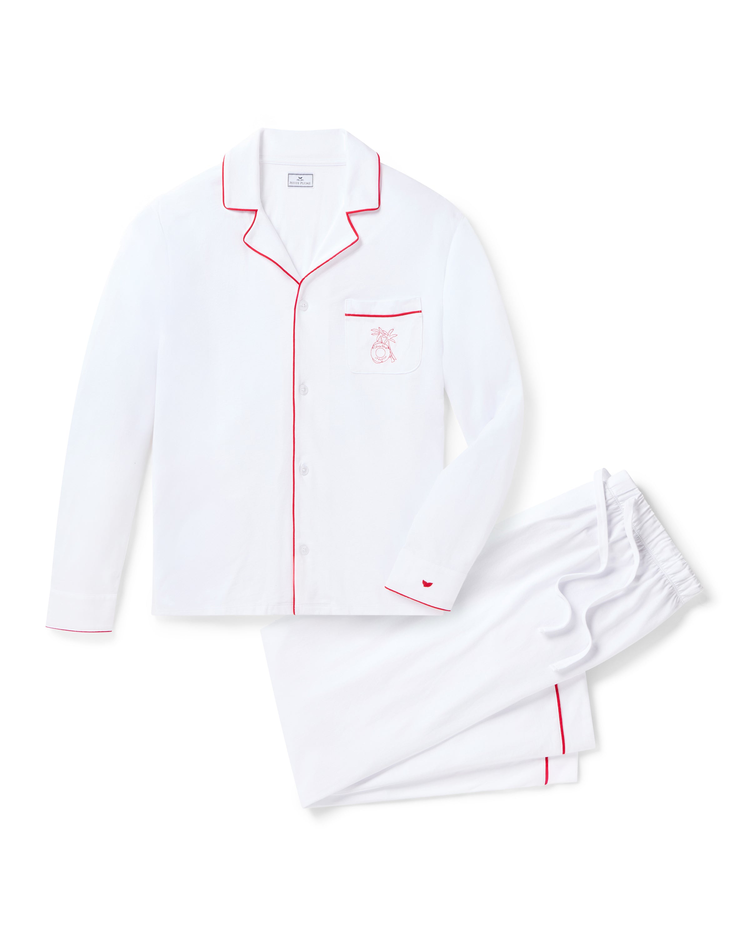 The Petite Plume x Eden Rock St Barth Mens White Pima Pajama Set features a luxurious white ensemble with red piping, including a long-sleeve button-up top and matching pants. The top has an embroidered apple chest pocket, part of our limited-edition collection by Petite Plume.
