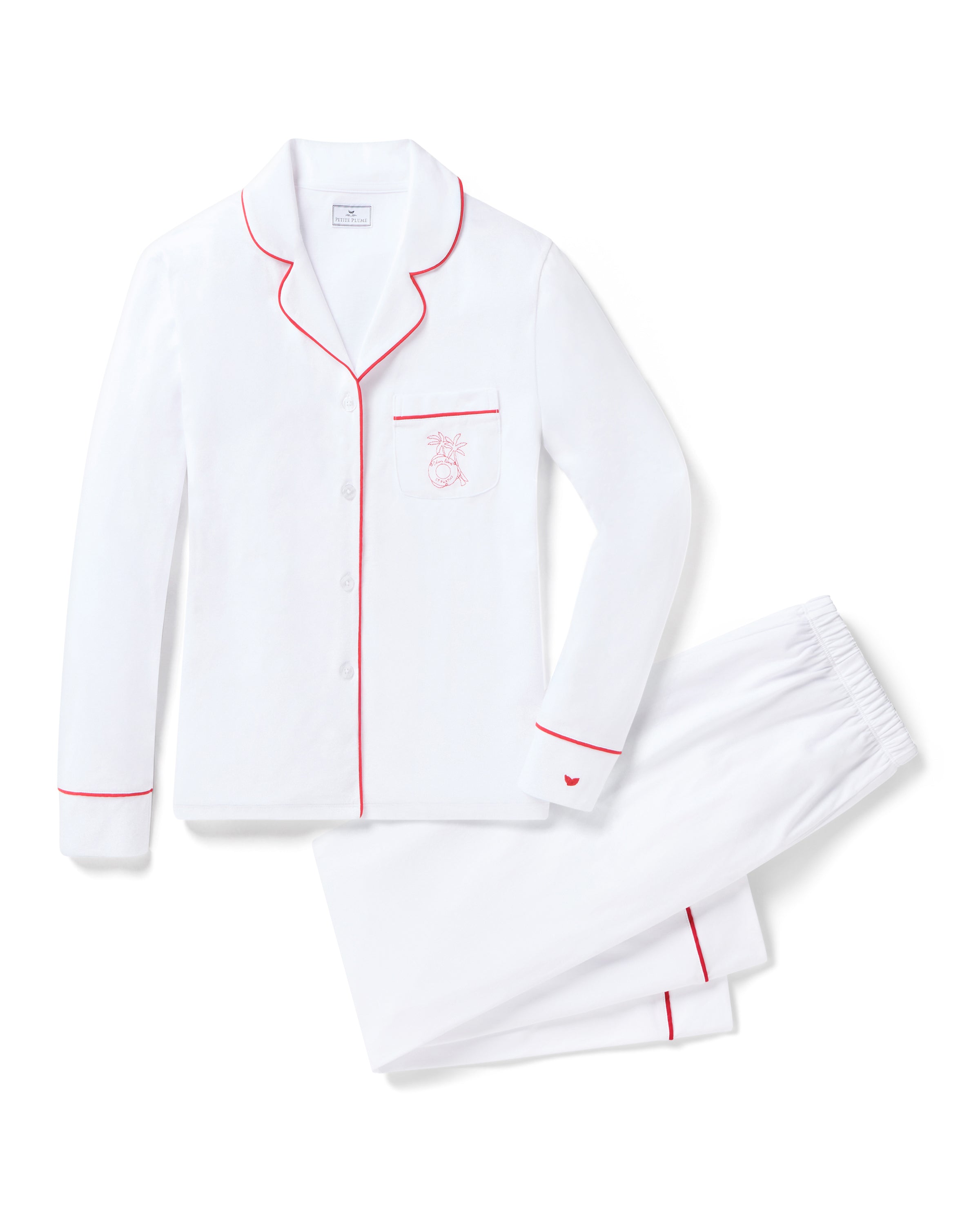 Introducing the Petite Plume x Eden Rock St Barth Womens White Pima Pajama Set: a limited-edition luxury sleepwear featuring red piping, a button-down top with an embroidered chest pocket, elastic waistband pants, and charming small red heart detail on the cuff.