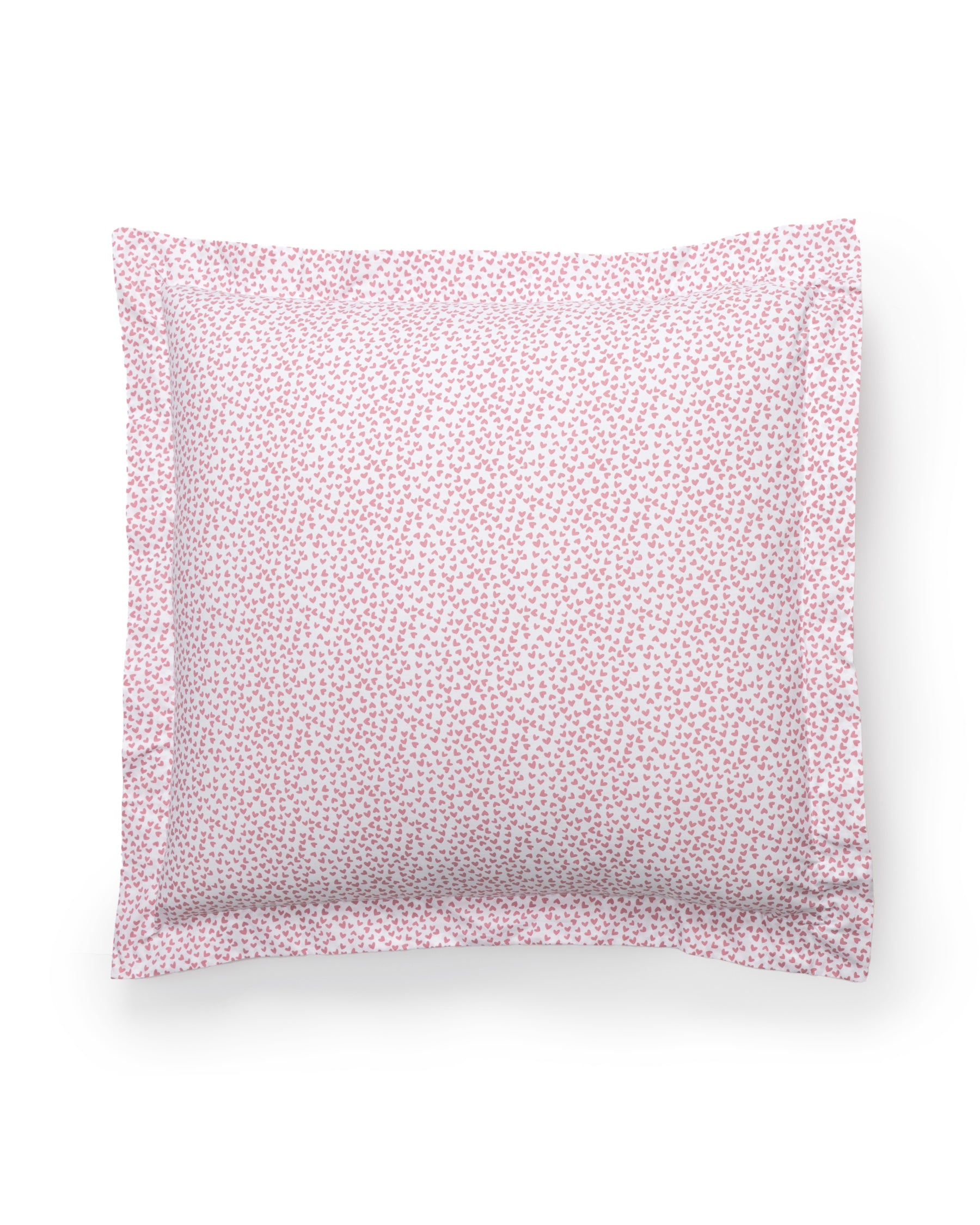 The Luxe Premium Percale Euro Sham in Sweethearts by Petite Plume is a cozy white pillow with a pink heart pattern and ruffled edge, crafted from percale fabric and shown against a white background.