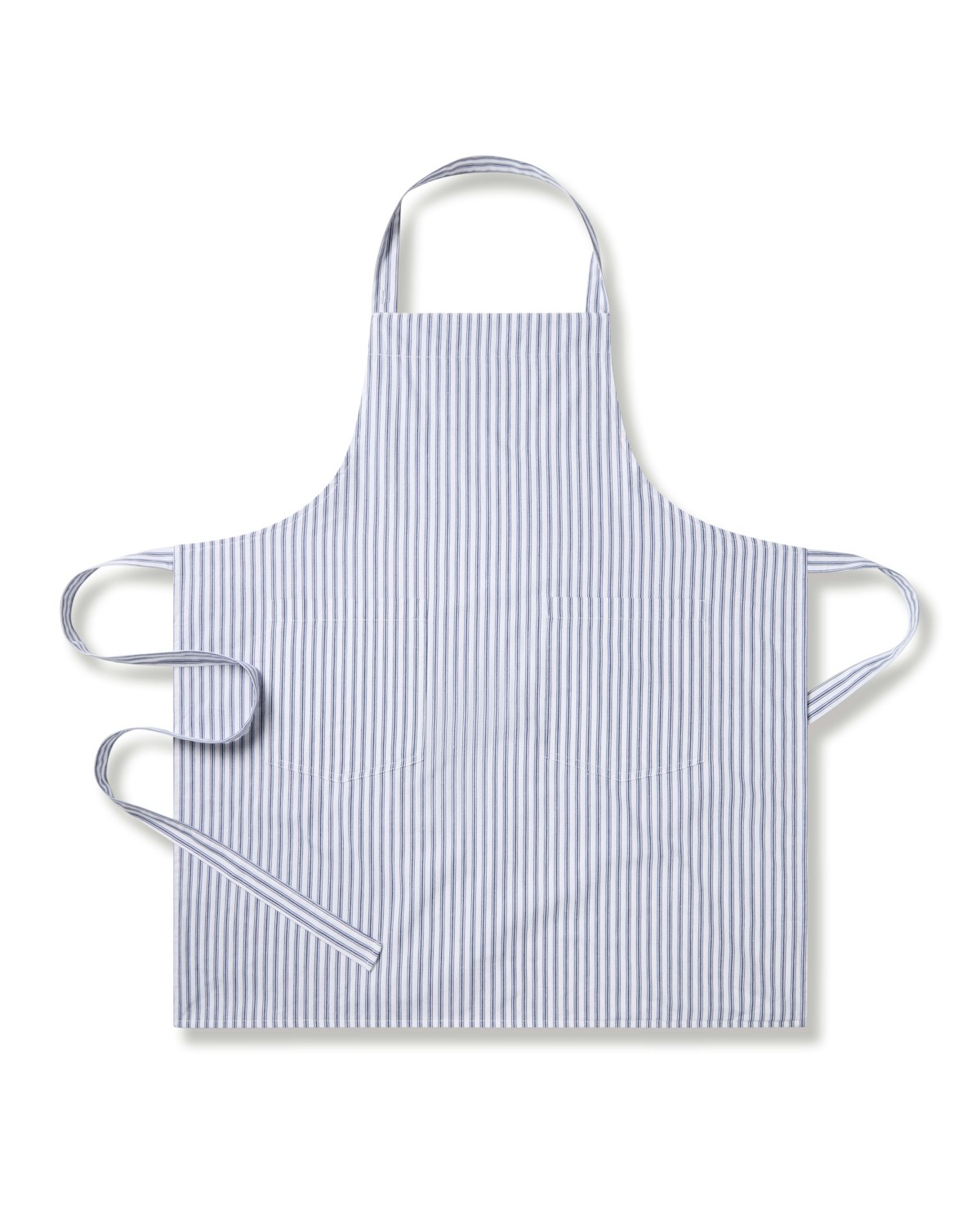 The Petite Plumes Adult Apron in Navy French Ticking features thin vertical blue and white stripes. Ideal for holiday baking, it has neck and waist straps with a diagonal flair, keeping you stylishly protected in the kitchen.