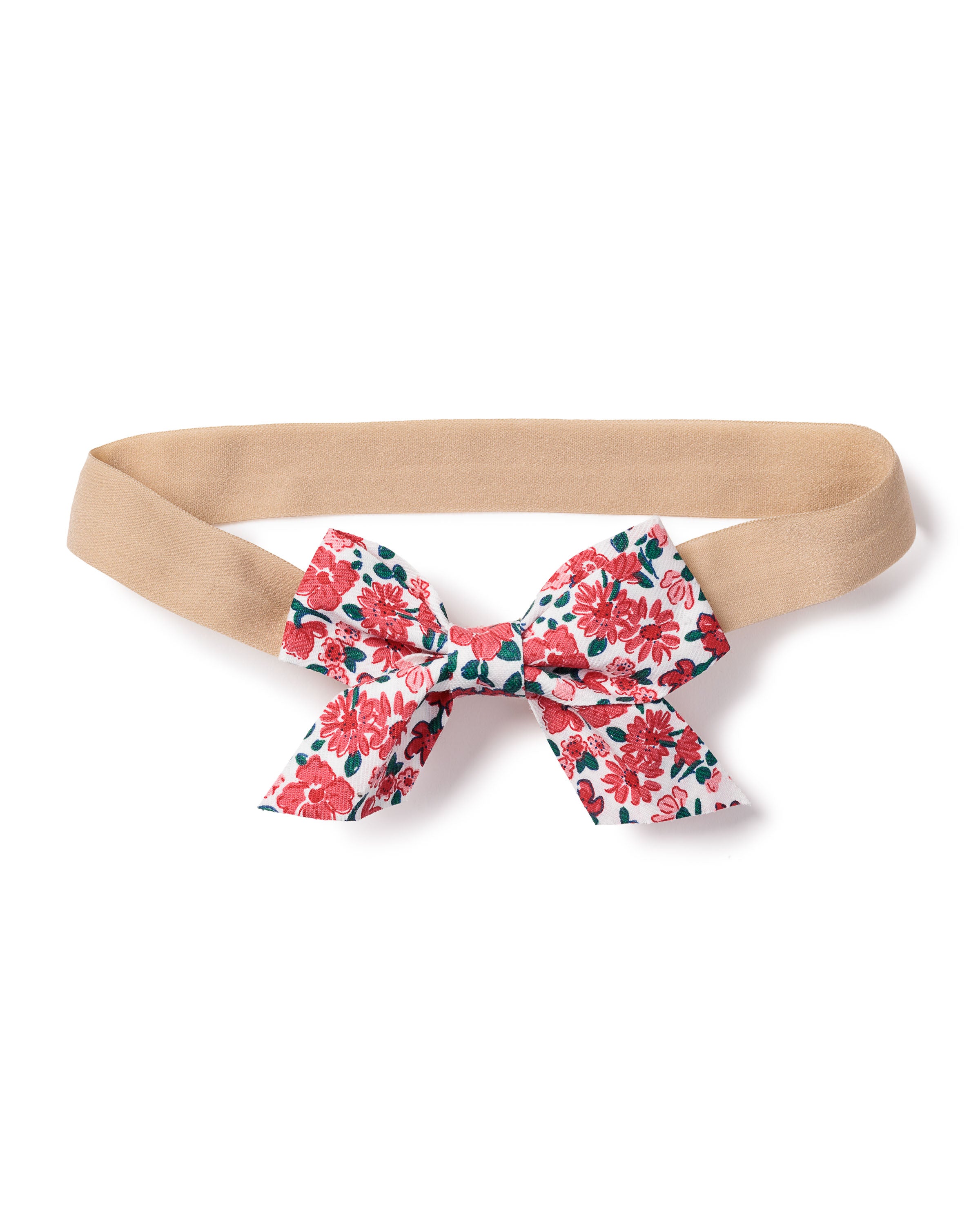 The Petite Plume Girls Twill Hair Bow in Fleurs des Bois is a charming tan headband featuring a fabric bow with red, pink, and blue floral patterns, making it the perfect hair accessory for pairing with casual outfits or cozy pajamas.