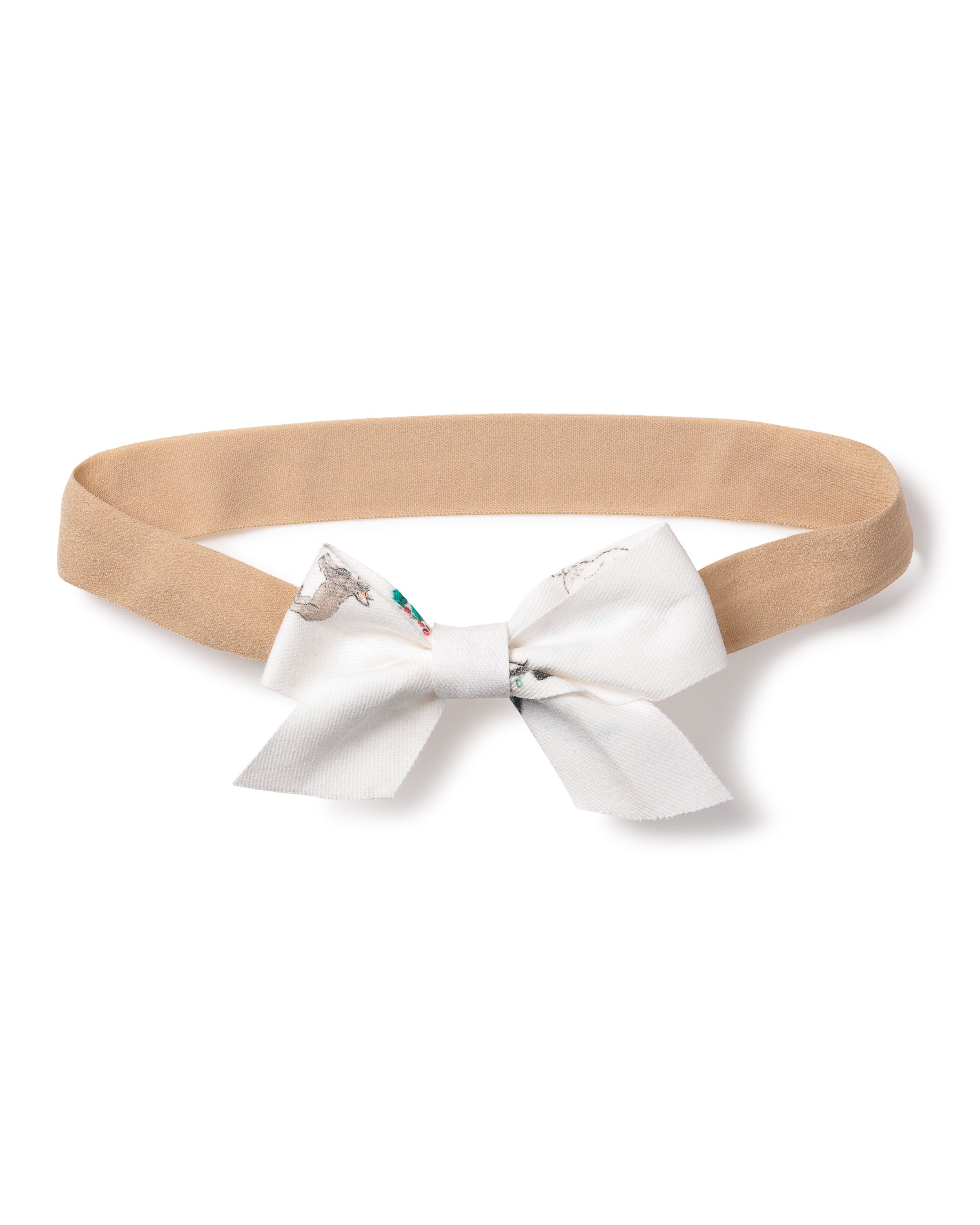 The Petite Plume Girls Twill Hair Bows in Jingle Paws offer a charming touch, with a beige headband and attached white bow featuring a delicate gray and floral pattern. Reminiscent of the Sugar Plum Fairy, its perfect for pairing with a twill romper.