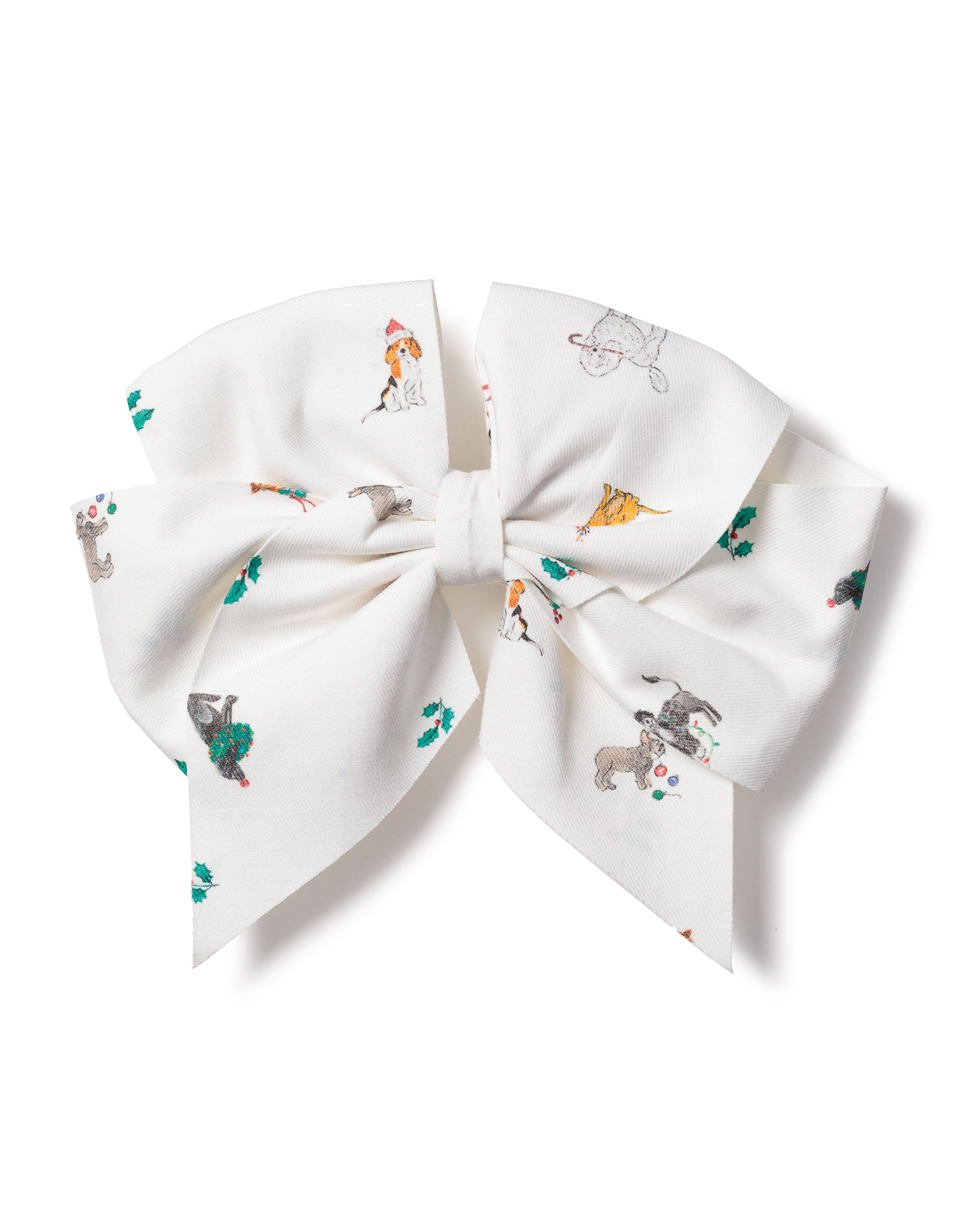 The Girls Twill Hair Bow in Jingle Paws by Petite Plume features playful dogs in hats, some chasing balls, others in festive poses. Tails hang beneath the loops like a Sugar Plum Fairys touch.