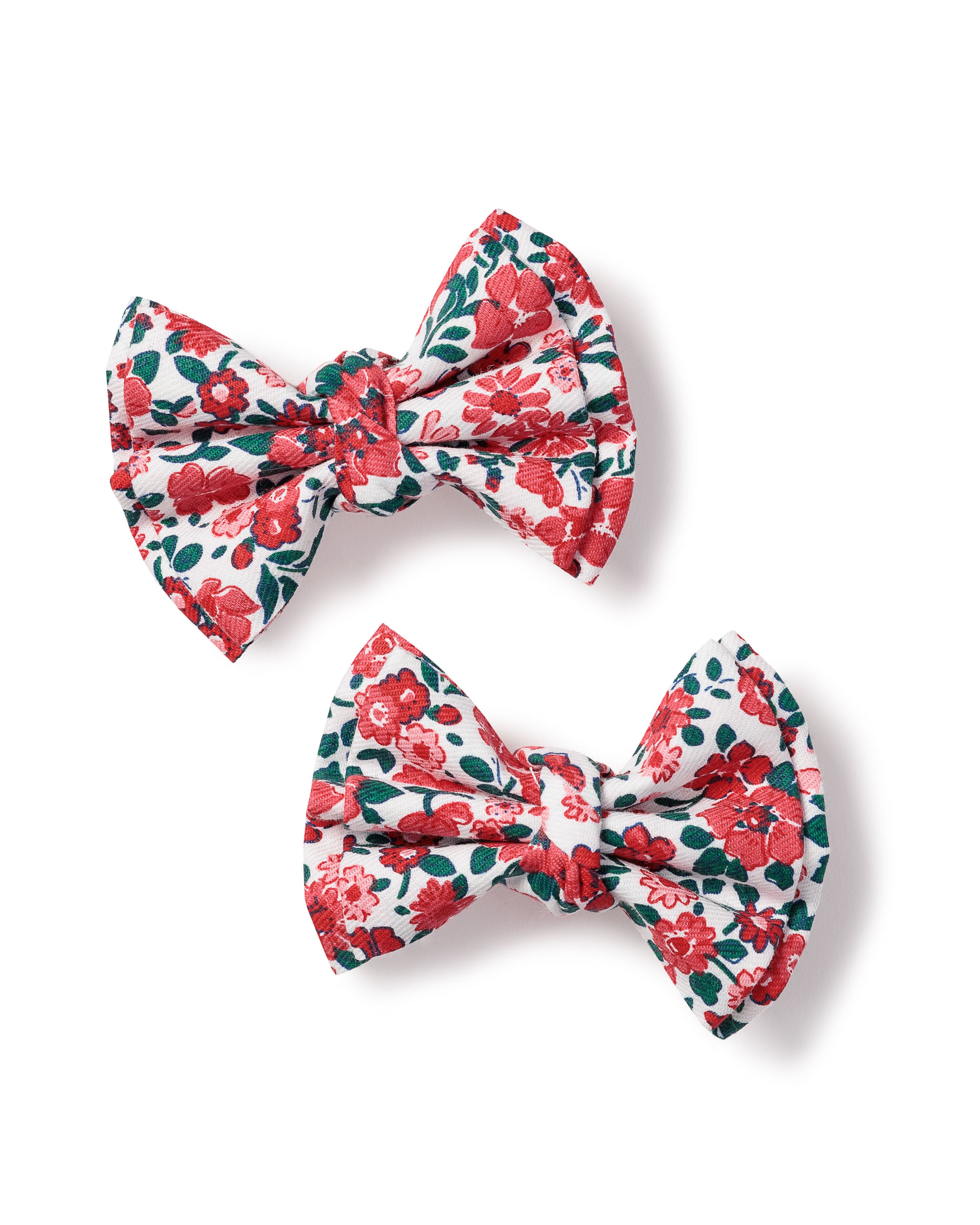 The Petite Plume Girls Twill Hair Bows in Fleurs des Bois feature two fabric bows with red and green floral patterns, perfect for girls hair.