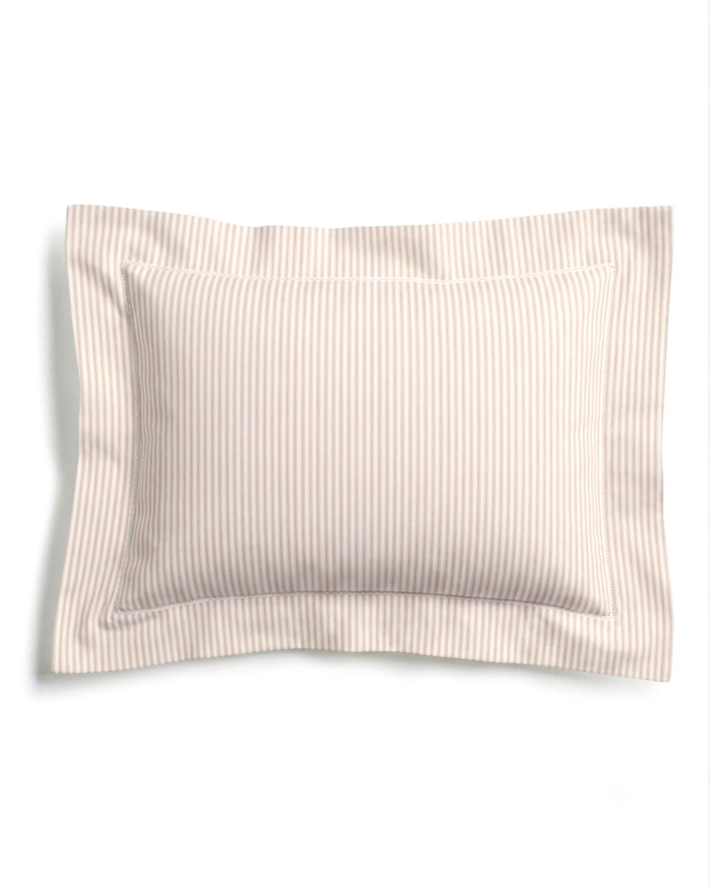 The Luxe Premium Percale Decorative Pillow in Camel Ticking Stripe is a rectangular pillow with a flange edge, featuring thin beige and white vertical stripes, set against a plain white background.