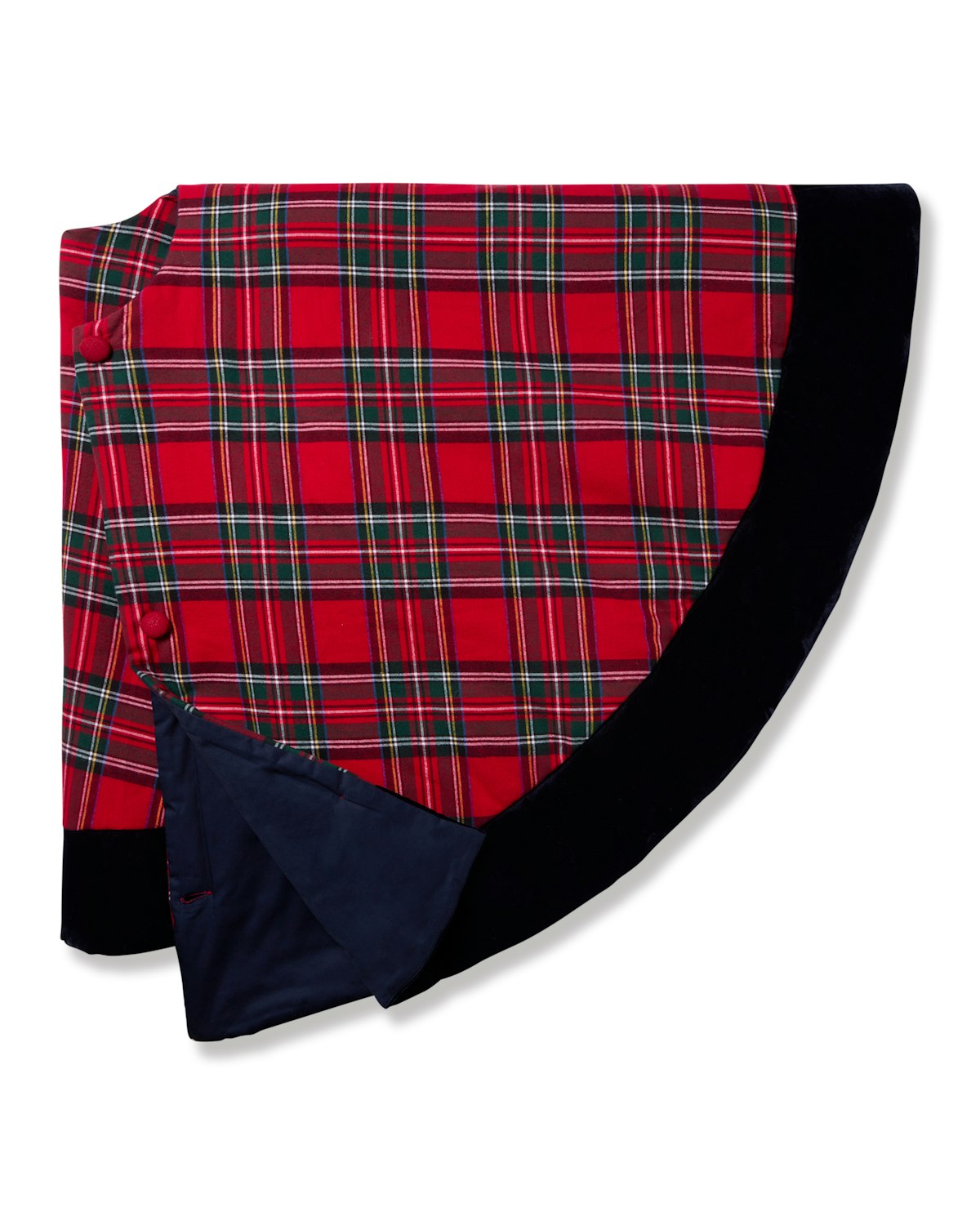 The Christmas Tree Skirt in Imperial Tartan by Petite Plume features a red plaid and green and white stripe pattern, with a solid black border. The dark blue inner lining flips to reveal red buttons, making it perfect for holiday decor.