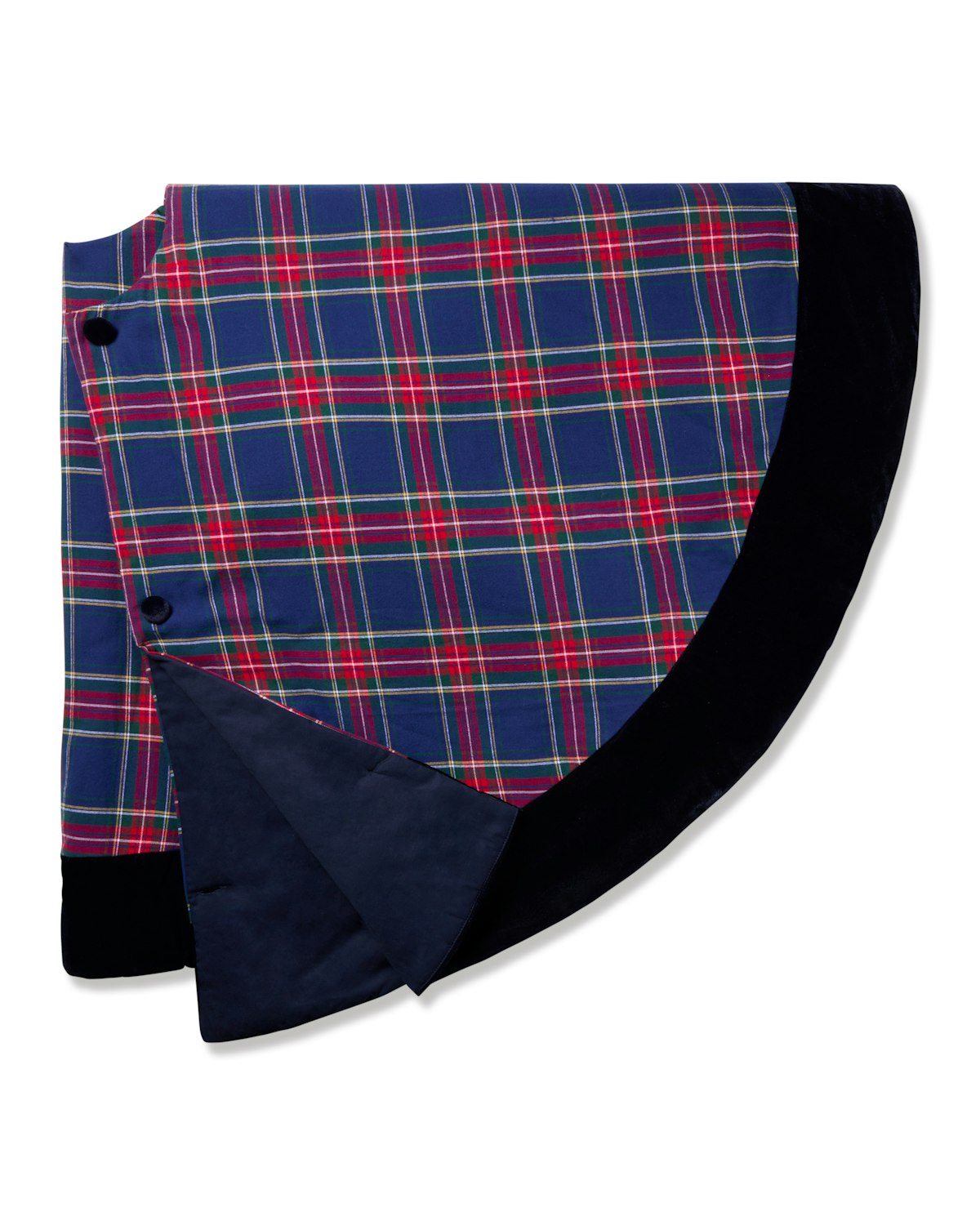 A circular Christmas Tree Skirt in Windsor Tartan by Petite Plume, featuring blue, red, and yellow plaid with a black border and button closure. Partially folded to reveal solid black underneath, this design seamlessly complements your festive decor.