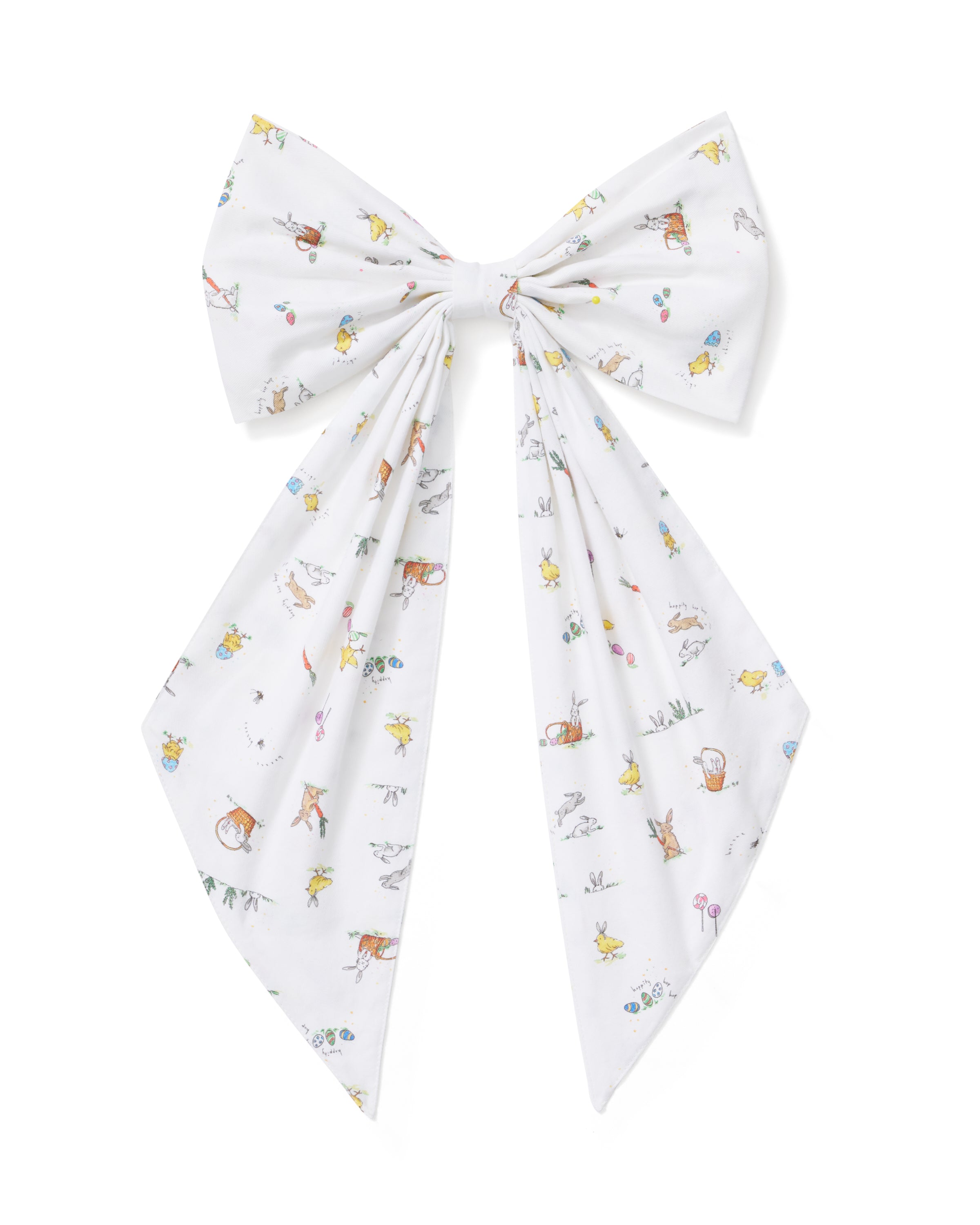 An Easter Basket and Wreath Bow in Easter Frolic with a large white bow featuring a pastel floral pattern is tied at the bottom of a wreath made of small white and pink flowers, hanging on a beige door.