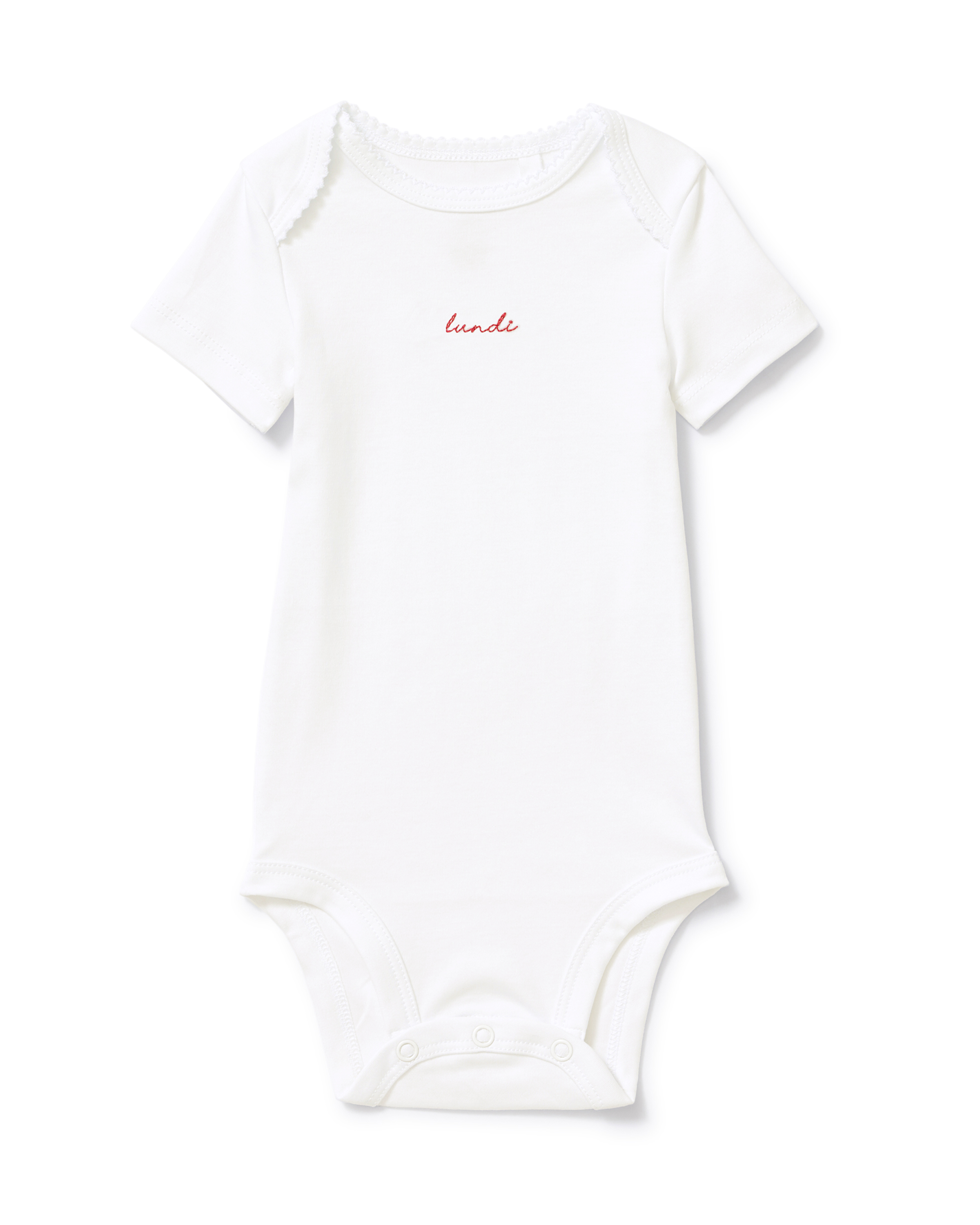 A pink short-sleeve baby onesie from the “Baby’s Pima Short Sleeve Onesie Set in French Lessons Pink,” featuring “lundi” embroidered in small red letters on the chest and snap buttons at the bottom.