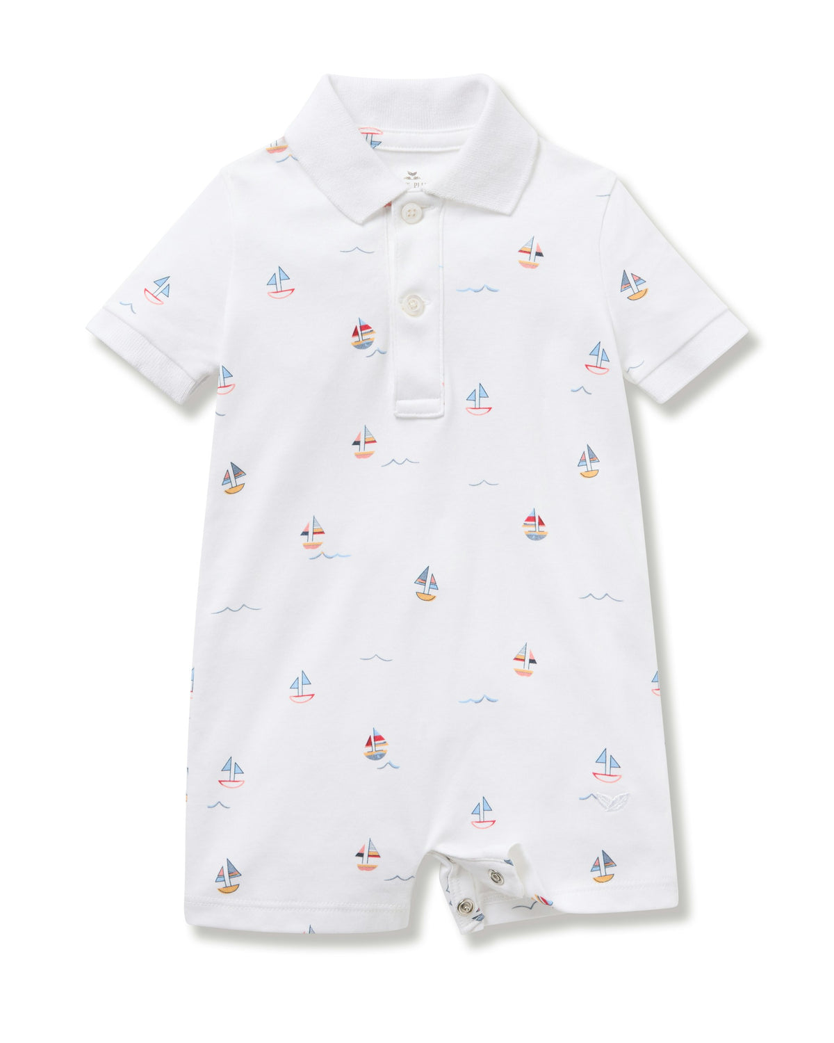 White baby romper with sailboat pattern on a white background