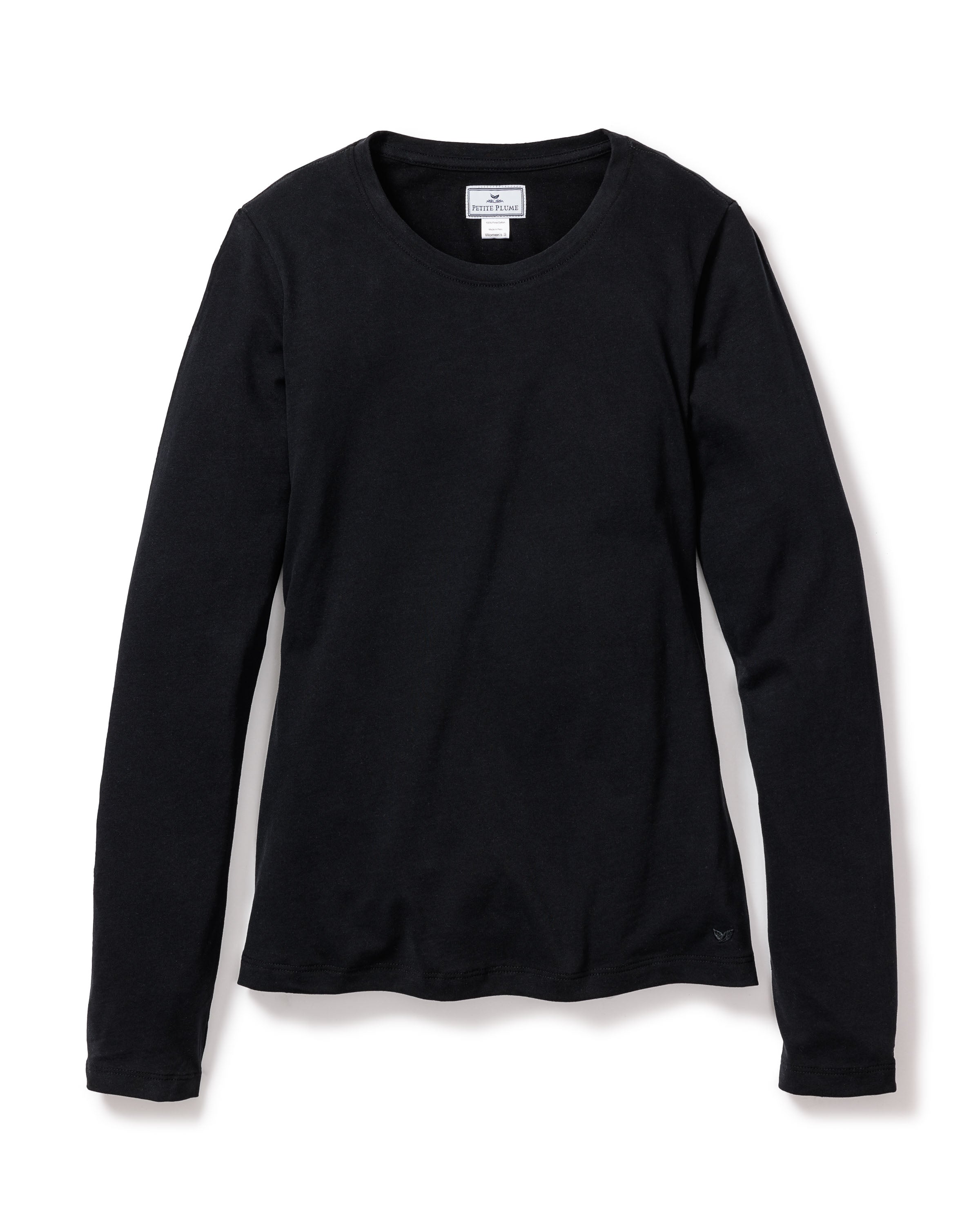 The Womens Pima Long Sleeve Top in Black by Petite Plume features a crew neckline and soft jersey-knit fabric made from Pima cotton, all against a white backdrop. A small inside back collar tag completes the simple yet comfortable design.