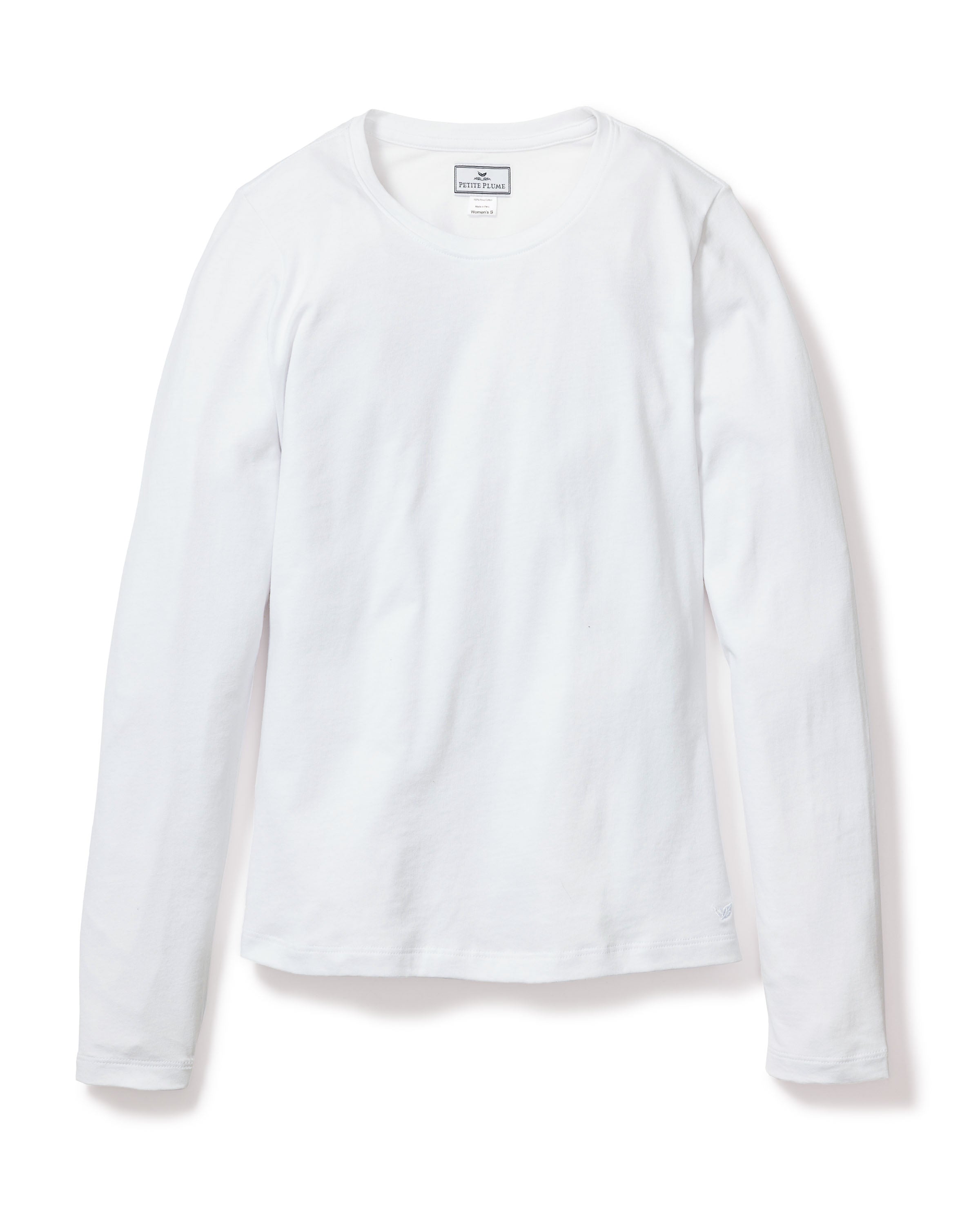 The Womens Pima Long Sleeve Top in White by Petite Plume is shown laid flat, featuring a clean crew neckline and soft Pima cotton fabric, ideal for luxury sleepwear or cozy jersey knit pajamas.