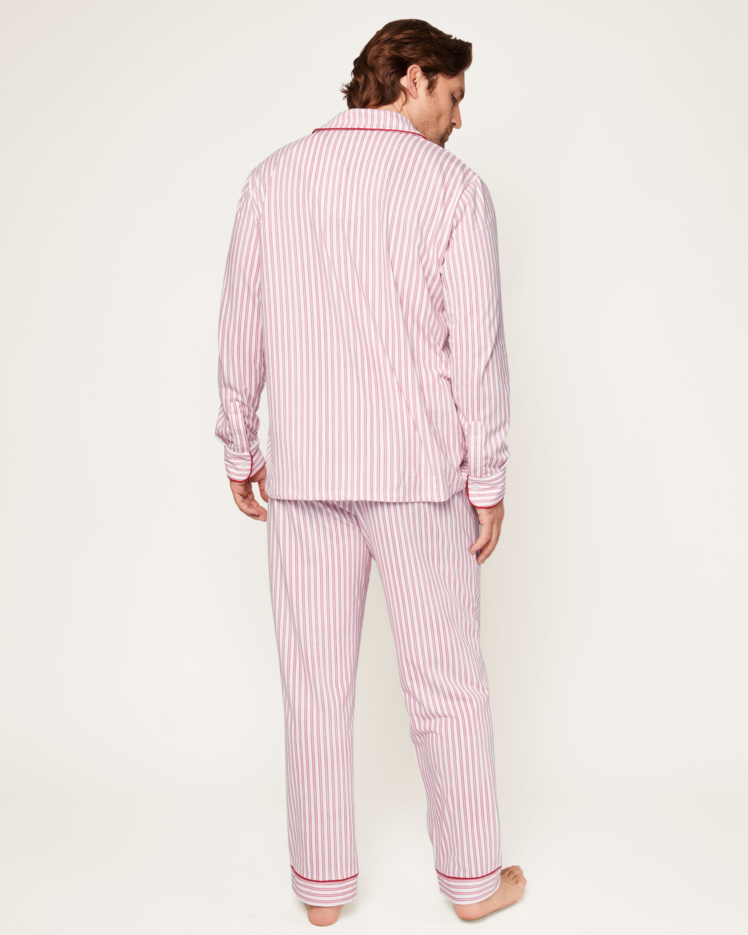 This close-up features the Mens Pima Pajama Top by Petite Plume in Antique Red Ticking. The luxurious yarn-dyed Peruvian Pima cotton showcases vertical red and white stripes with a visible button and pocket outlined in red piping, ensuring softness and comfort for restful nights.
