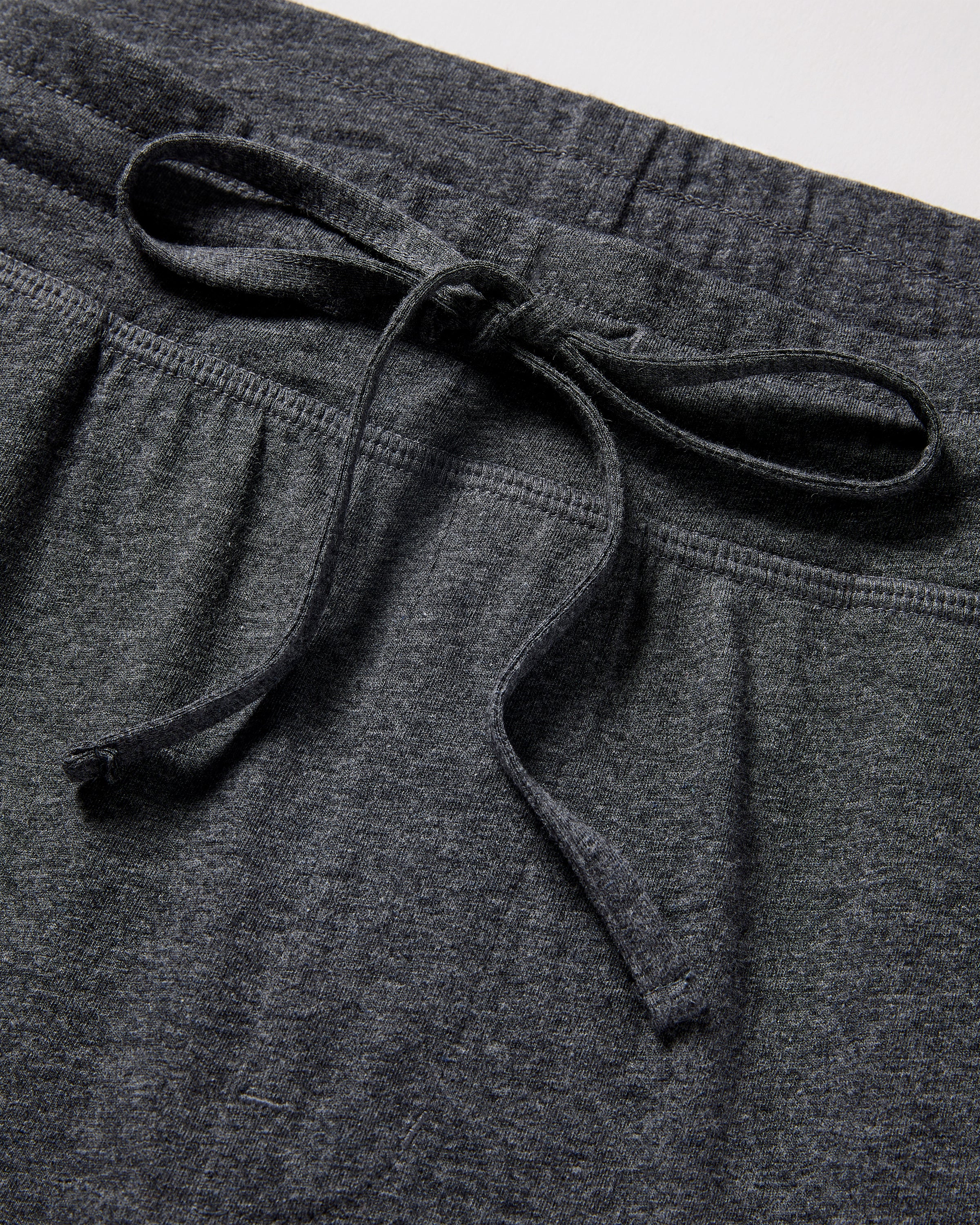 Close-up of the waistband on Petite Plumes Mens 5 Pima Short in Dark Heather Grey, featuring a matching drawstring bow and soft, textured Peruvian Pima cotton for comfort and casual style.