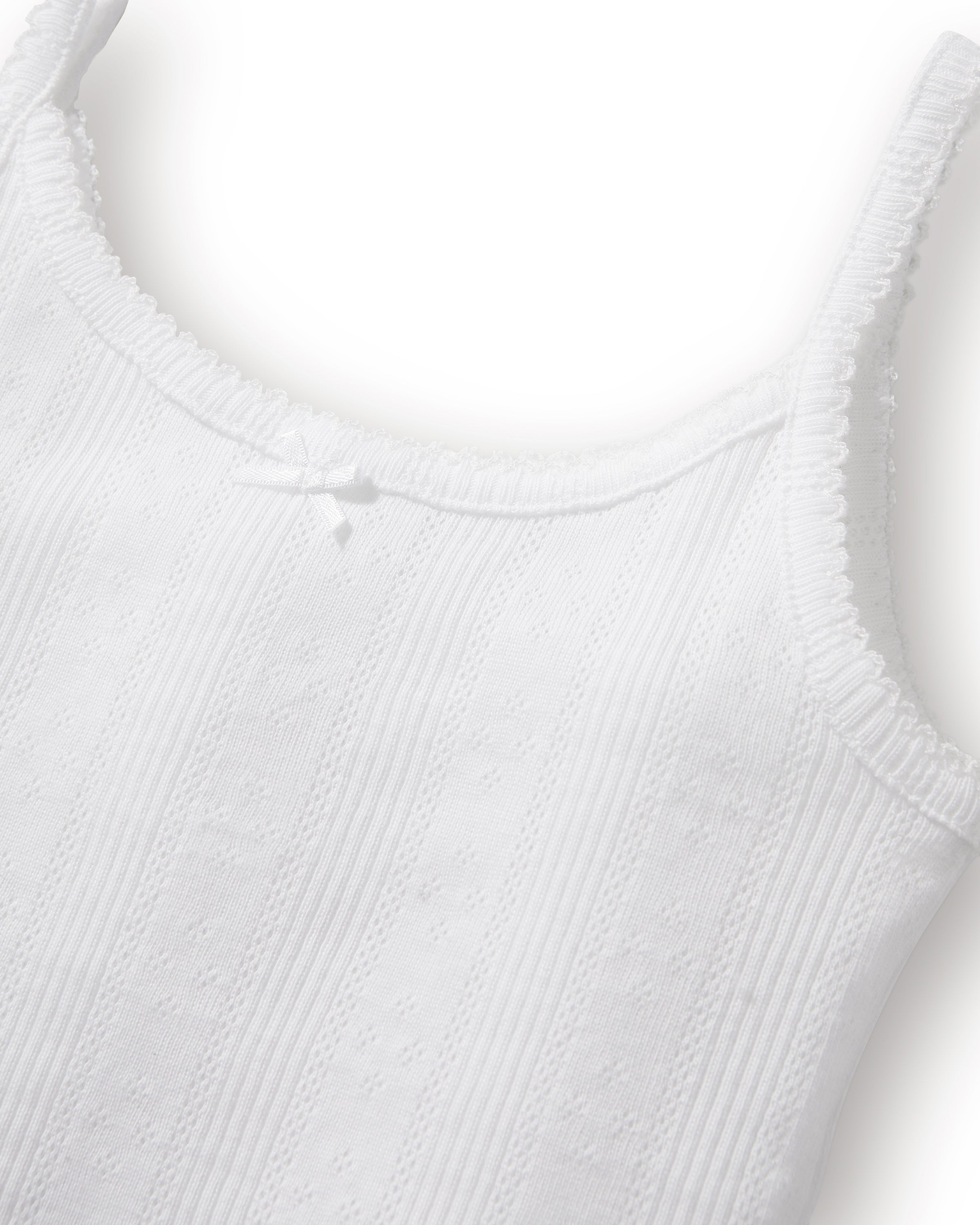 The Kid's Pointelle Cami Set of 2 in White & Pink Floral includes two sleeveless camisoles: one plain white with a bow and one white with a pink and green floral pattern. Both feature thin straps and lace trim.