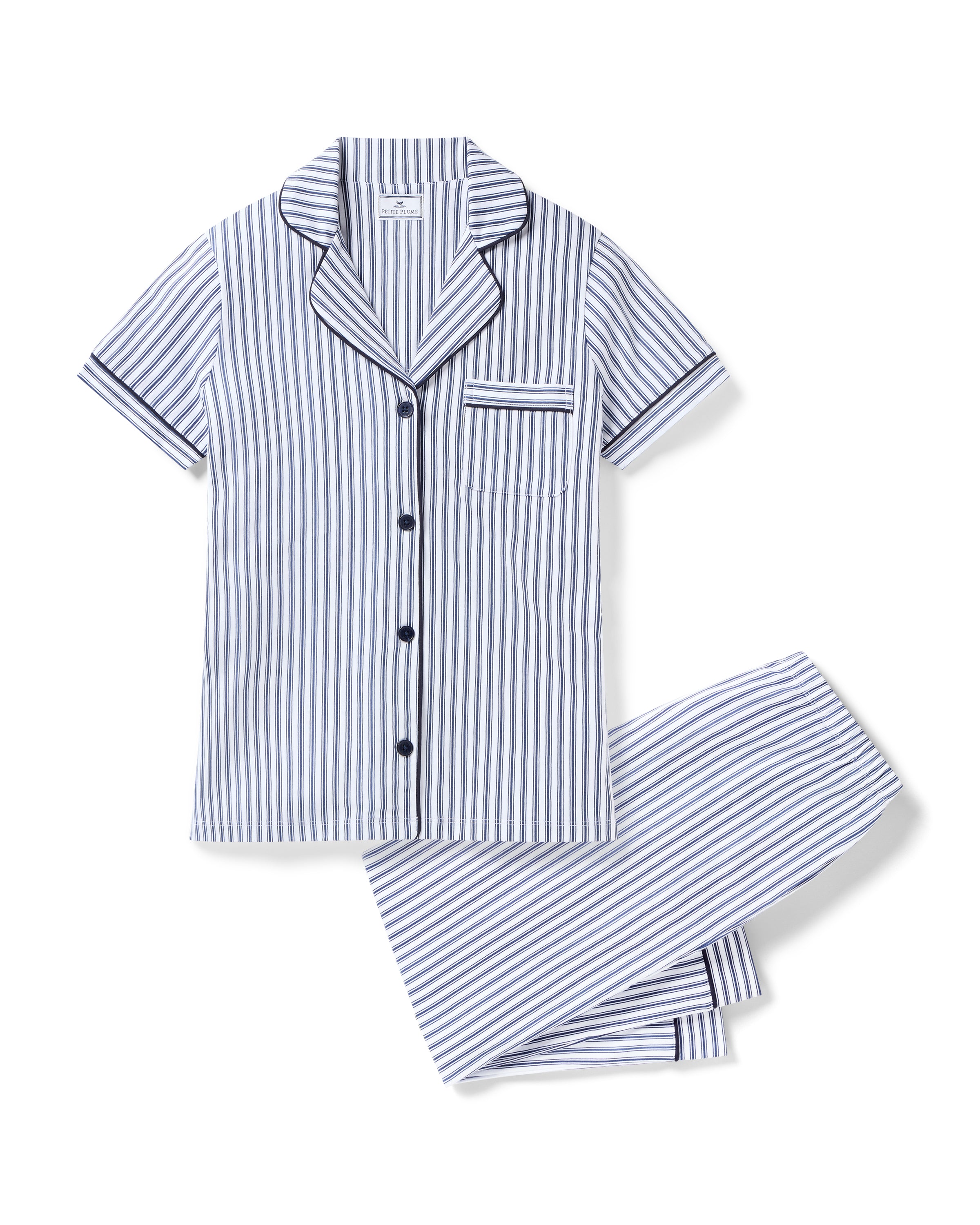 The Women's Pima Crop Pajama Set in Navy French Ticking features a blue and white vertical stripe design, short sleeves, a collared button-up top with chest pocket, and matching long pants.