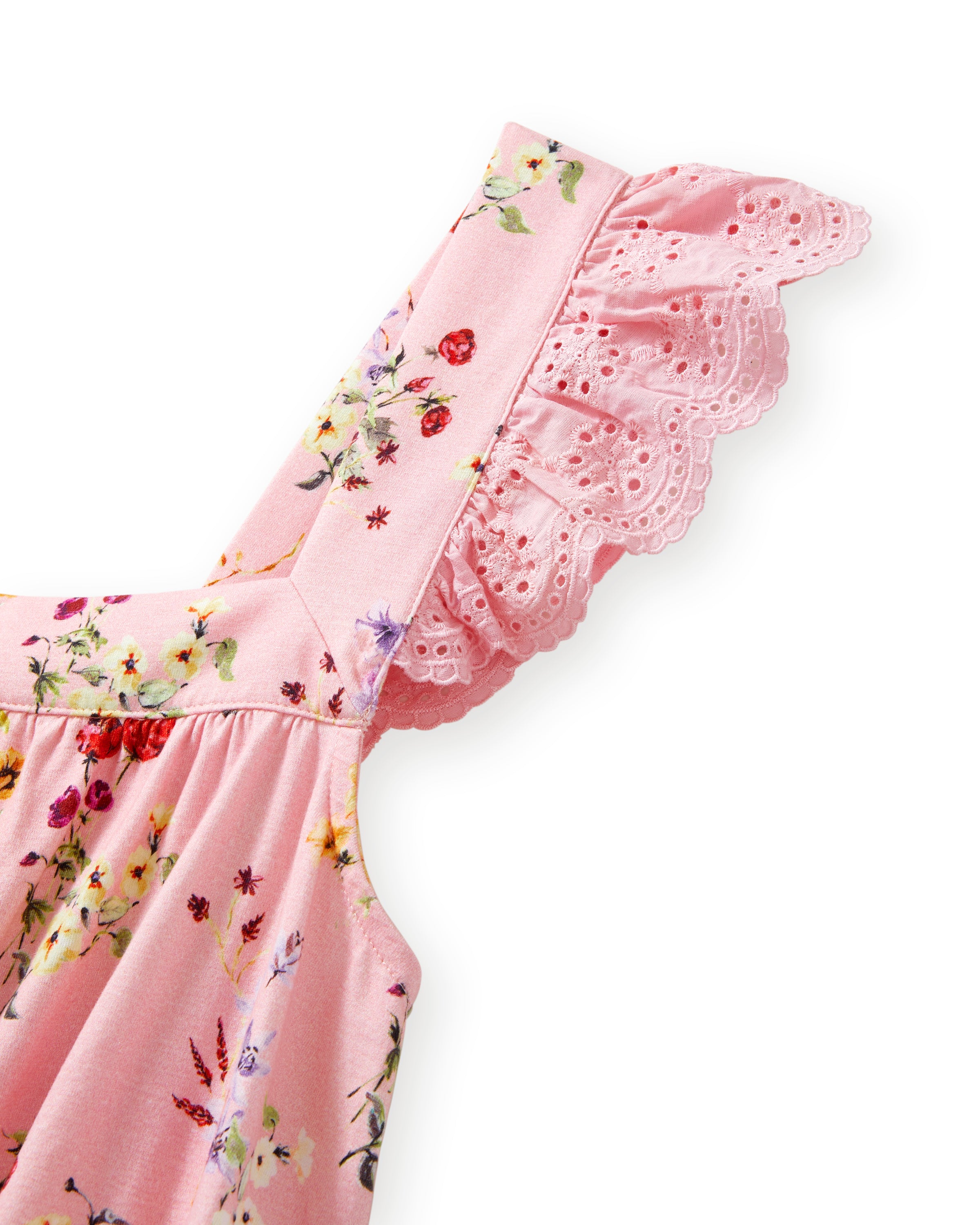 The Women's Pima Clara Short Set in Brilliant Botanical Blush features a matching pink pajama set with a sleeveless top, ruffled straps, and shorts, both adorned with a colorful botanical print.