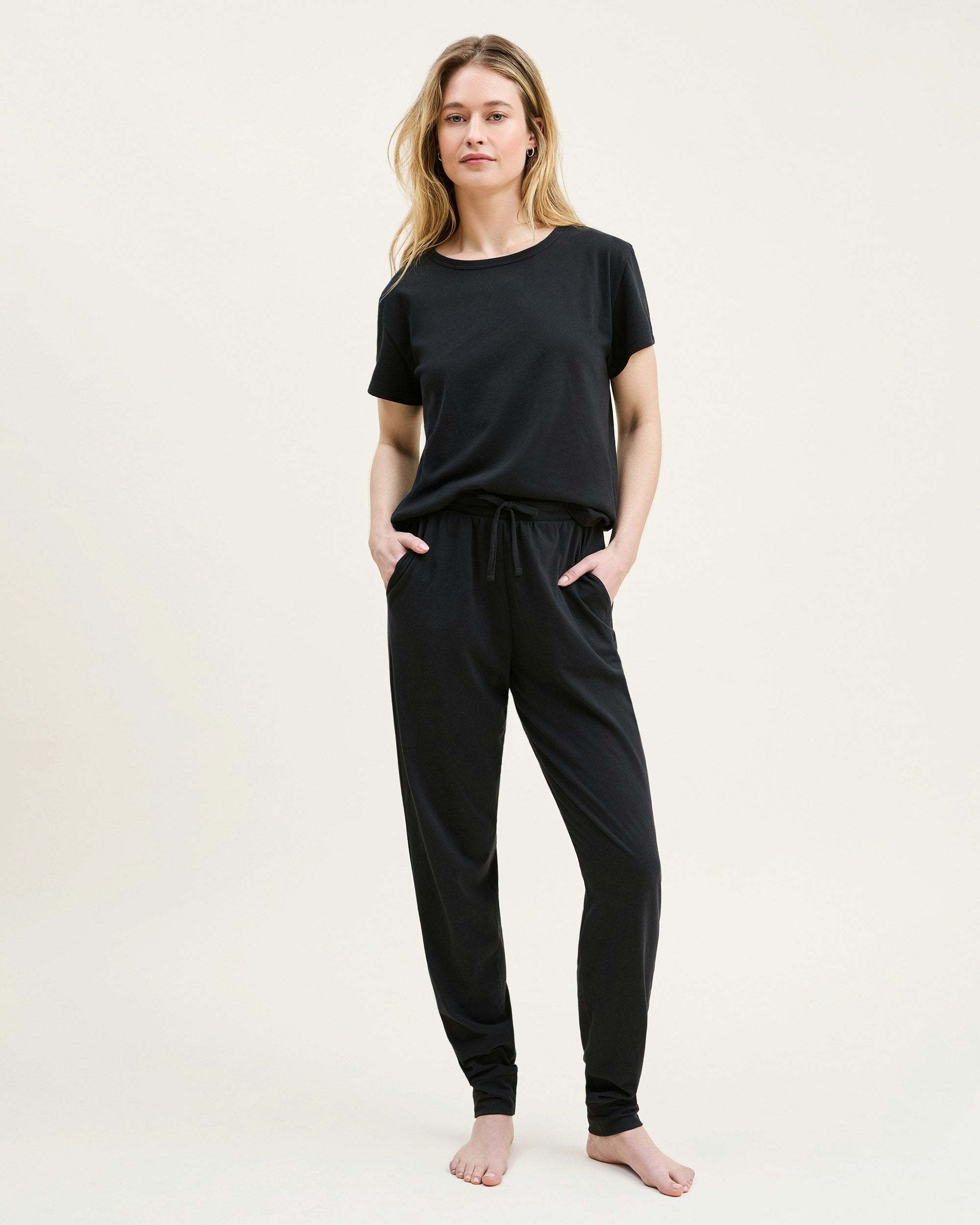 A black crew neck t-shirt made from pima cotton, displayed against a white background.