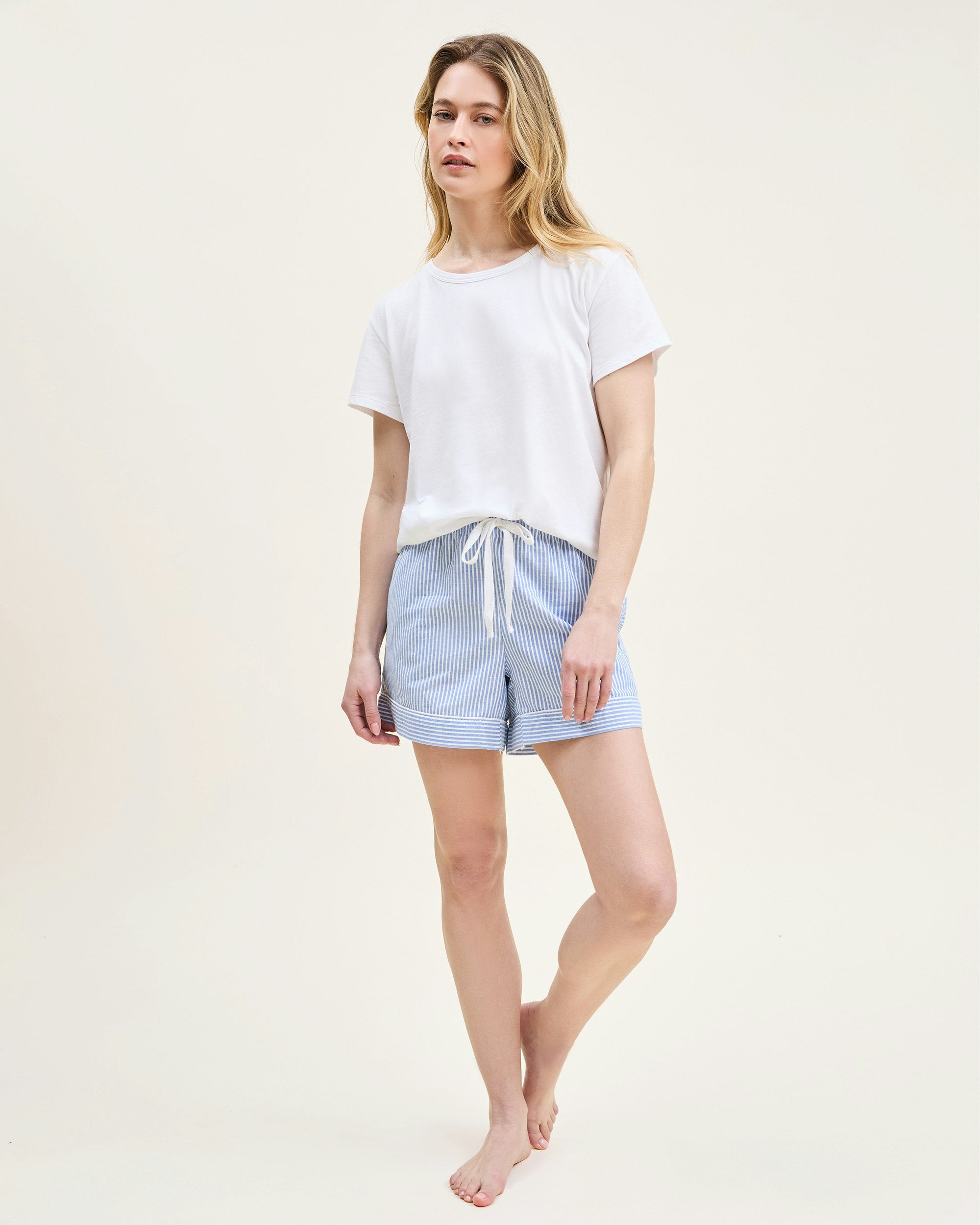A white crew neck t-shirt made of pima cotton, displayed against a plain background.