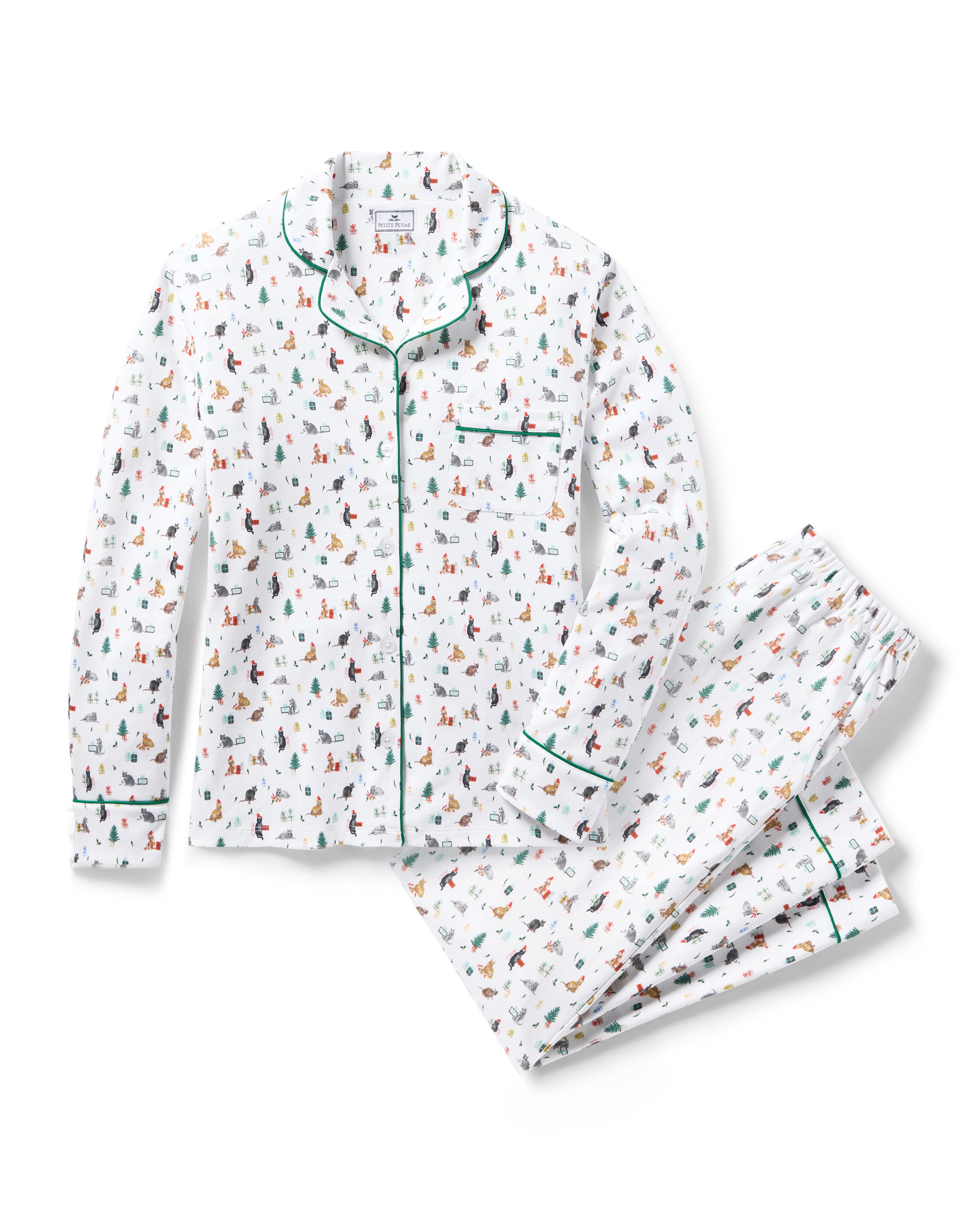 The Women's Pima Pajama Set in Merry Meow features a white, green-piped pajama set with a colorful cat print. Includes a long-sleeve button-up top with chest pocket and matching pants.