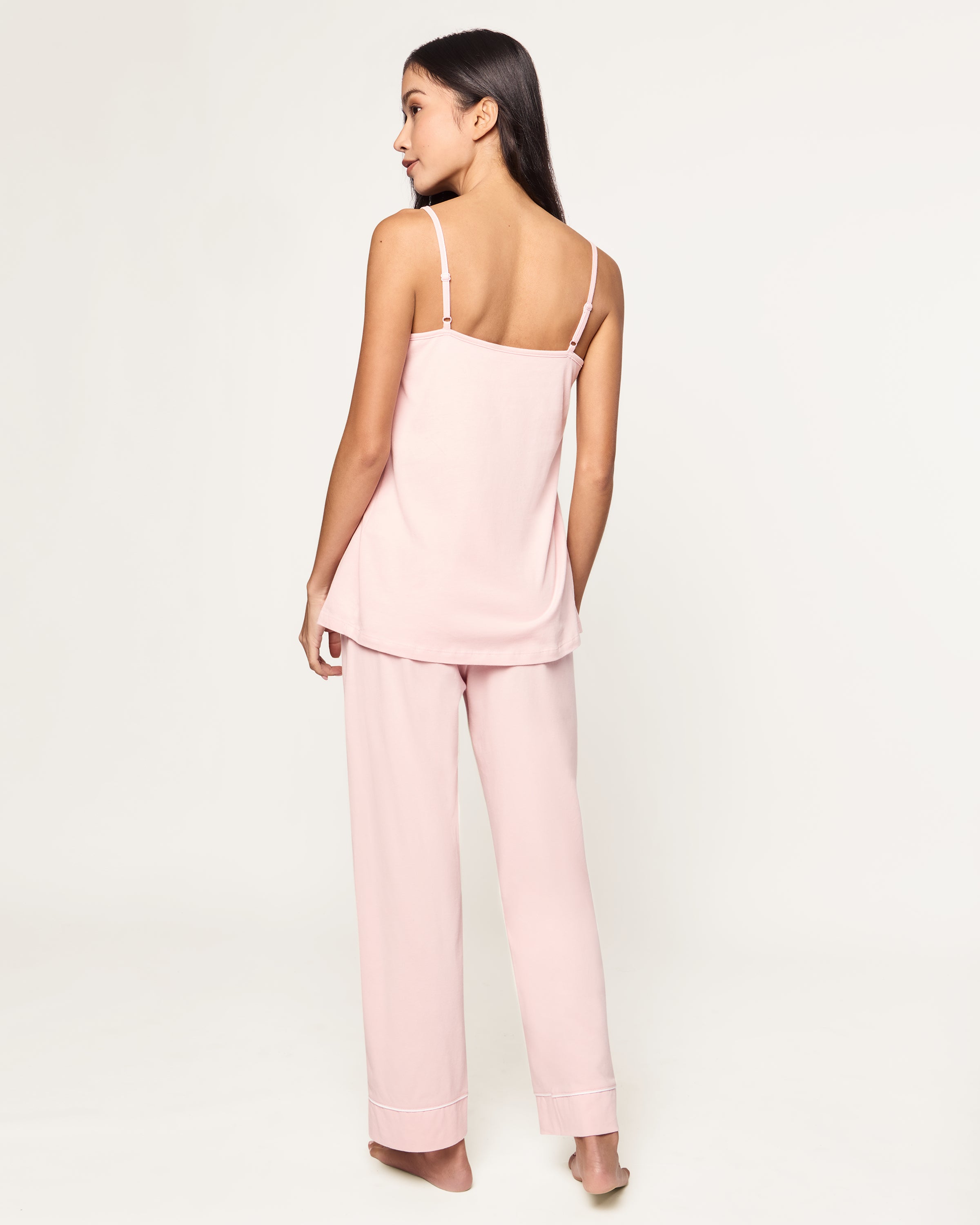 The Women's Pima Sylvie Pajama Set in Pink includes a sleeveless V-neck camisole with thin straps and matching elastic-waist pants, both accented with subtle white stitching.