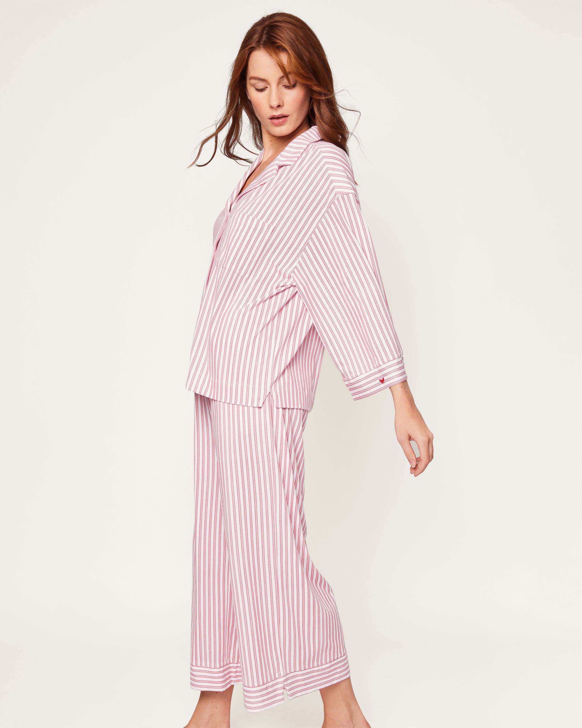Featuring the Petite Plume Olivia Pajama Set in Antique Red Ticking, this shirt is crafted from luxurious Peruvian Pima cotton with an embroidered logo on its sleeve and a classic white button front design.
